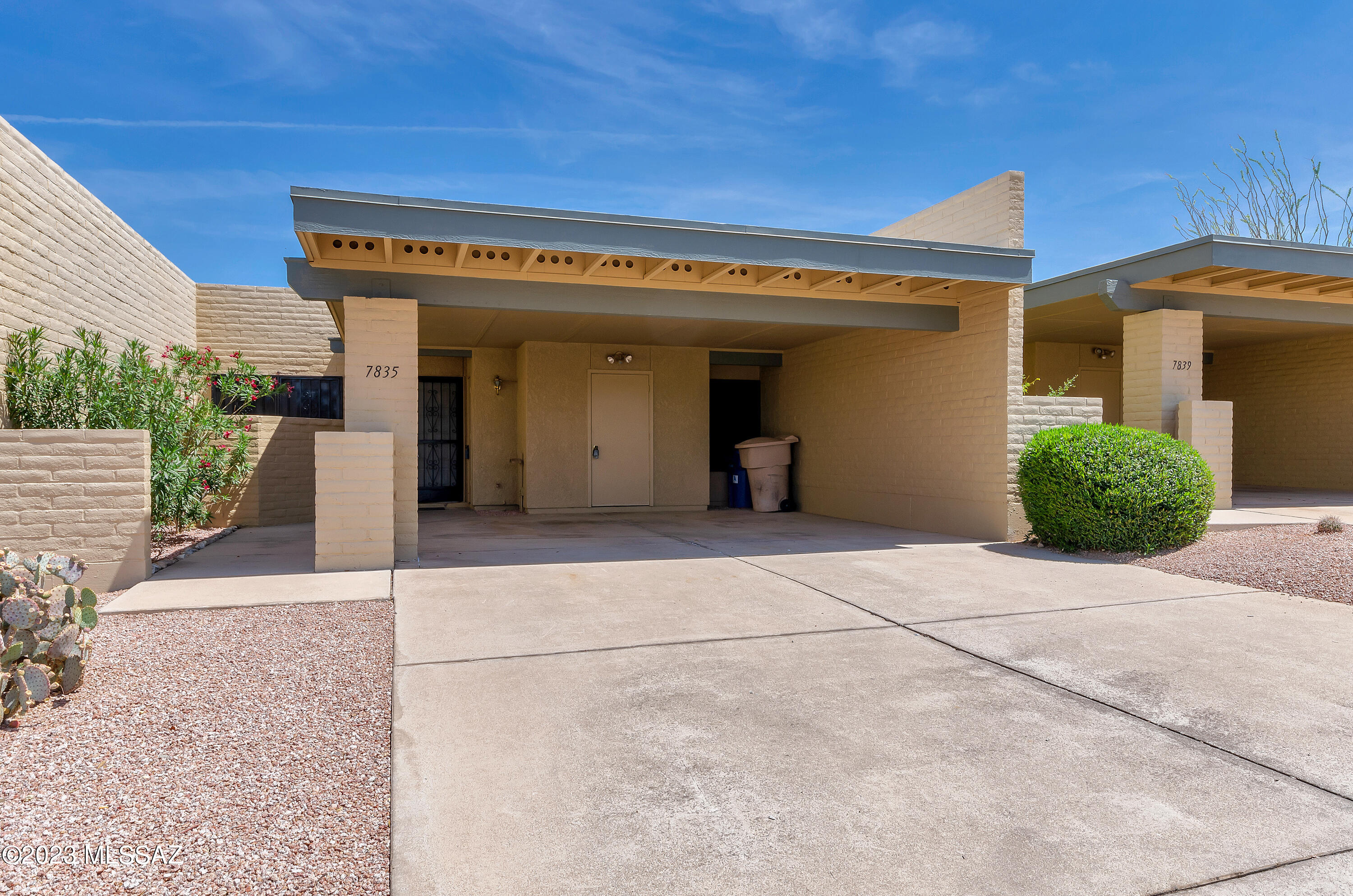 Desirable East side townhouse! Casa Real offers very low HOA fee of $100 per month. This includes 2 pools, 2 tennis courts, common area maintenance and care of the building exteriors. This open floor plan has been freshly painted and new carpet installed in the bedrooms. Tile throughout the rest of the house has been steam cleaned. Eat in kitchen with new sink and faucet. Great room and kitchen have new ceiling fans. Beehive fireplace in the great room. Pass through from kitchen to counter. New water heater. Screened in porch and walled yard. Charming home in a charming sought after location!