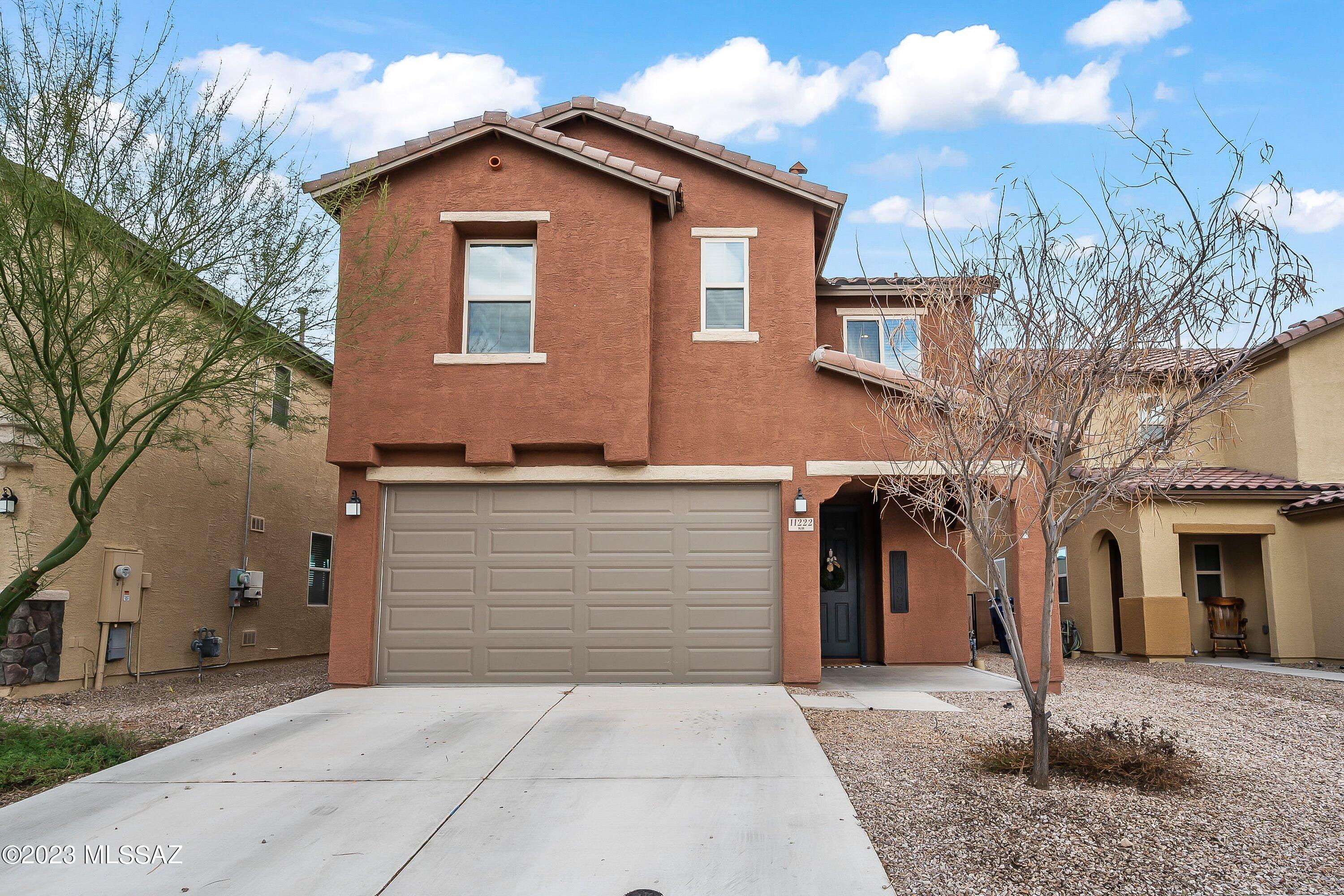 Bright and open floorplan, 2010 Sq Ft two story home with 3 bedrooms, 2.5 bath plus loft. Walking distance to Award Winning Vail Schools. Spacious eat in kitchen features mocha cabinets, granite, gas range, farm sink, pantry, breakfast bar and pendant lighting. Adjoining family room with slider to back patio, chandelier, and powder room. Easy care tile throughout downstairs. Relax in your master suite with dual vanities and walk in closet. Great loft and office space. Additional upstairs bathroom with plenty of counter space, closet and double shower-head. Low care backyard is ready for your personal touch, includes patio, raised garden bed, and pavers. Refrigerator conveys. Washer and dryer do not. **In ground trampoline has been removed and hole has been filled.**