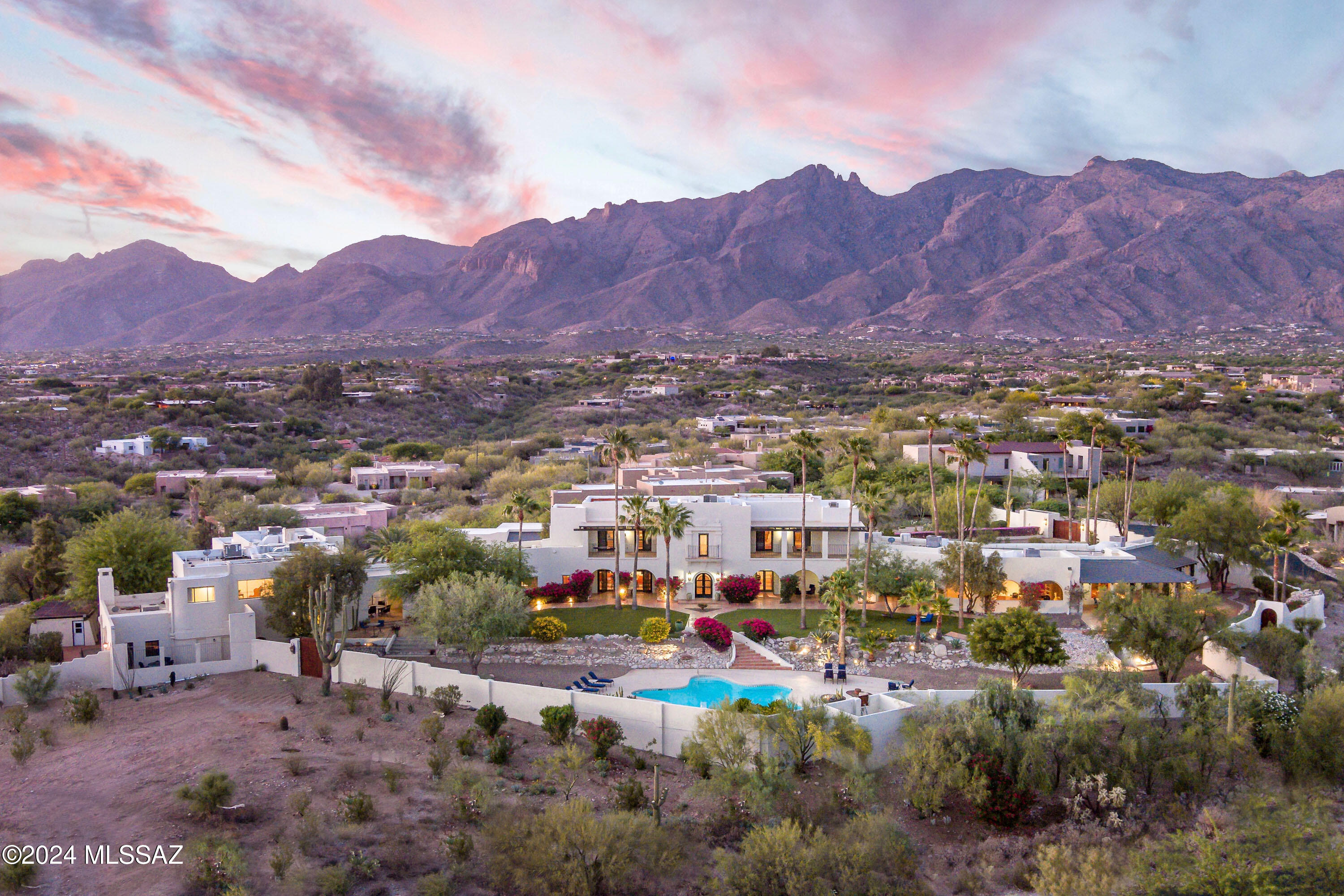 AUCTION BIDDING OPEN: Bidding ends 1/23. Previously Listed $6.5M. Current High Bid $3.3M. Showings Sat-Sun 1-4 PM and By Appt. 

Eleven Arches, also known as the Grace Mansion and built for shipping heiress Louise N. Grace, stands as a testament to timeless elegance in Tucson's prestigious Catalina Foothills. 

This 1936 Josias Joesler masterpiece, meticulously restored over eight years and listed on the National Register of Historic Places, offers an unparalleled living experience across 15,502 square feet for historic grandeur and modern luxury. 

The main residence, crafted with 24-inch mud adobe walls, features three bedrooms with potential for a fourth, while three versatile guest casitas provide additional accommodations.

Light-filled interiors showcase platinum-grade Gypsum plaster walls and exquisite Italian lime-marbled dust plaster in the formal dining room. 

The estate's grounds span over four acres with breezeways, patios, and lush grounds, presenting panoramic city views, resort-style amenities, and space for grand-scale entertaining. A resort-style pool, art collector-worthy gallery system, and thoughtfully preserved architectural details create an extraordinary sanctuary with prestige and timeless elegance.