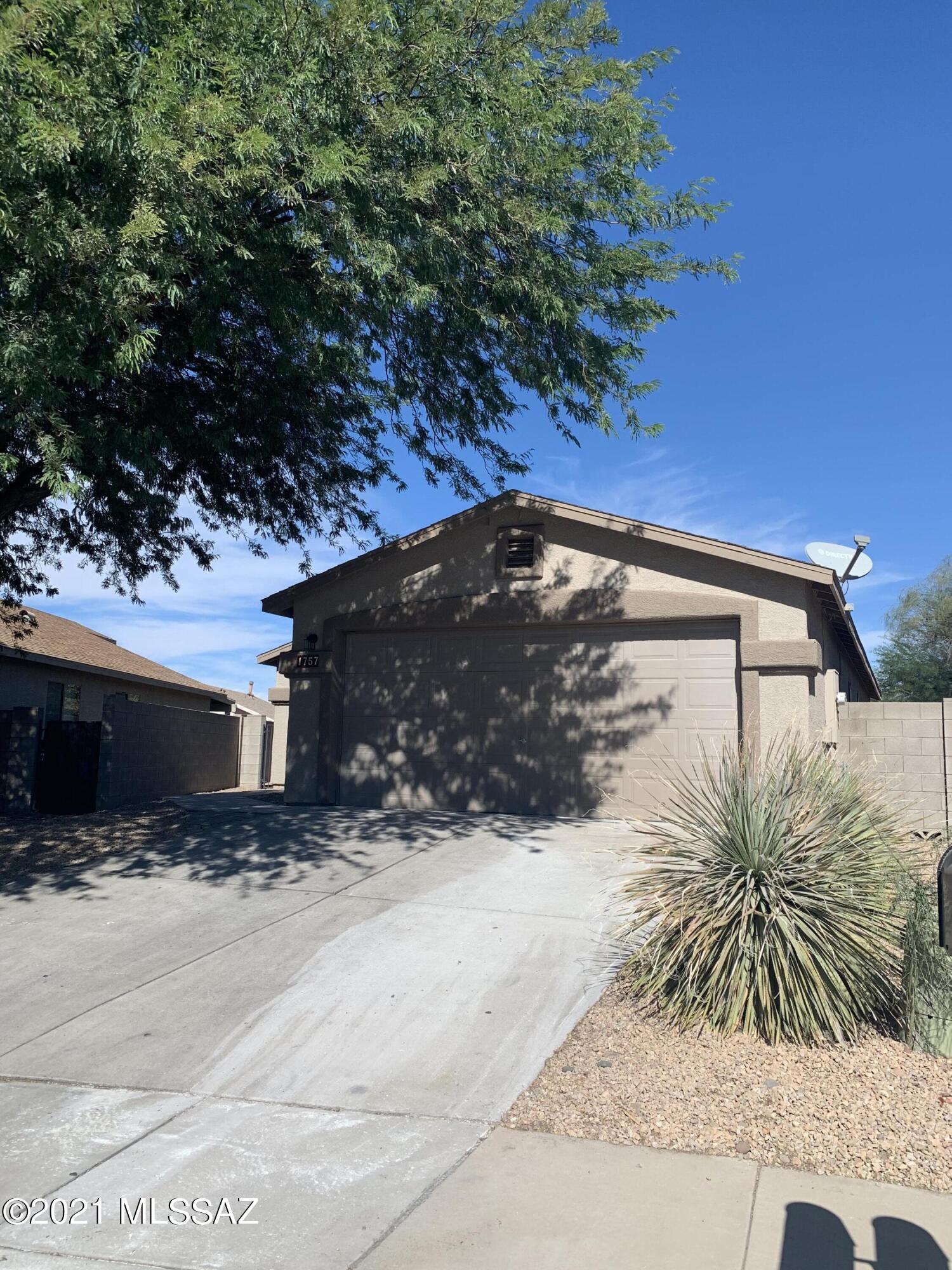 Cute 3BR/2BA House with brand new paint, carpet, landscape rock in the front and back yard. Conveniently located a short drive from I10, the UofA, Tucson Marketplace, Schools, Shopping and more! Small walled in back yard with a small covered patio. Turn Key Home ready for for move in!