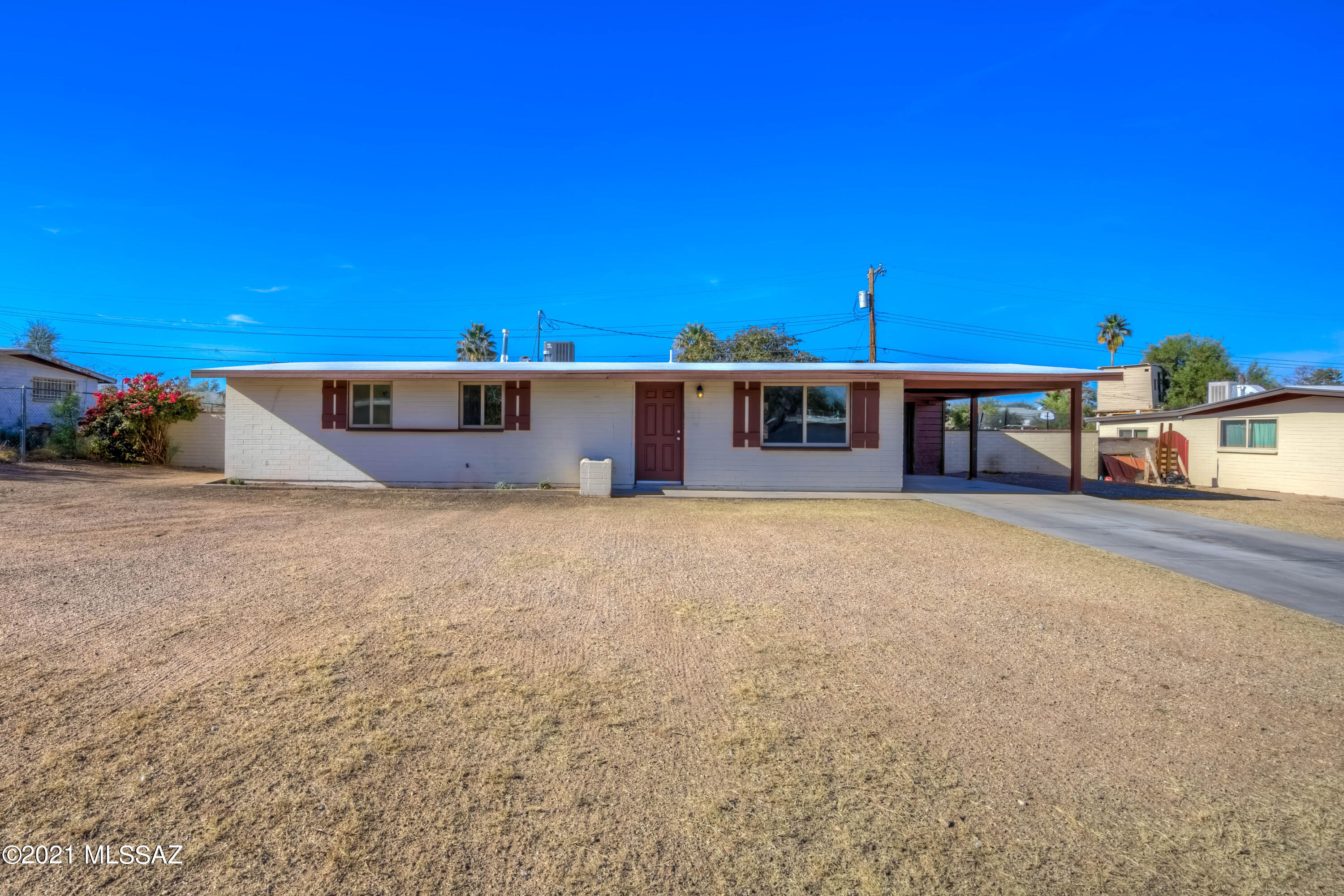 Sellers will entertain offers between 250K and 260K range. Freshly painted, move-in-ready three bedroom, two bathroom home on large .21 acre lot, in highly desired Terra Del Sol subdivision! Dual pane windows, new light fixtures, new A/C unit, new water heater.  Carport storage room is large enough to be a workshop. Walled in back yard is enormous with a long covered patio, perfect for entertaining. Roof has just been recoated and both bath/showers reglazed to perfection.  Room for RV or other toys. No HOA but there is a community pool where neighbors can optionally have membership. Fridge and stove to be installed before closing. Close to schools, park, shopping, bus lines, you name it. Hurry on this one!