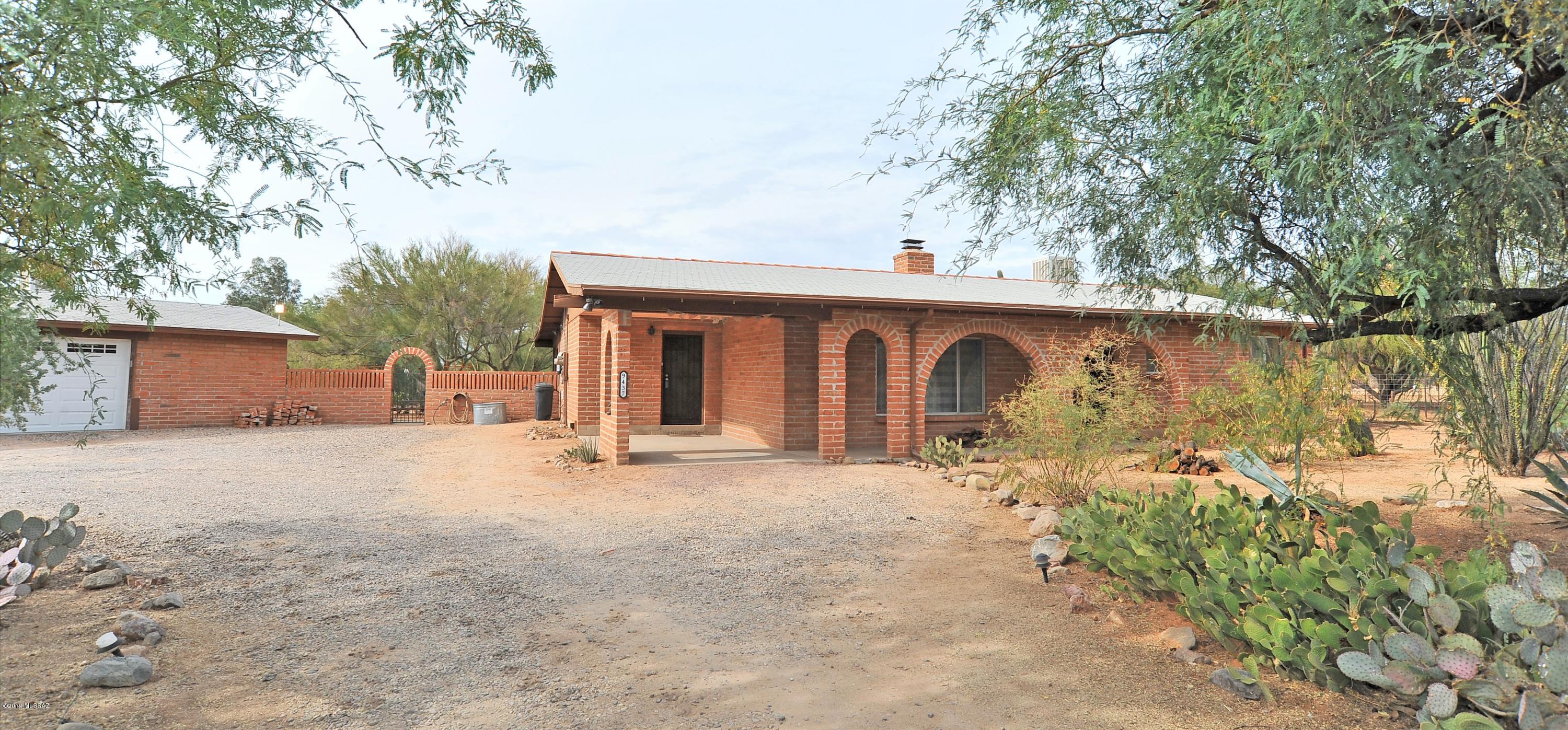 Horse facilities at a great in-town location! With over 3-acres of manicured horse property, the grounds feature a 1% graded dressage arena, mare motel, tack room, hay shed, room for RV & trailer parking, a chicken coop, and even a bridle path that encircles the property's perimeter. The Arizona room contributes an additional 490 SF of wall-to-wall windows that can serve as an easy-to-clean entertaining space or as a mudroom as you re-enter your home from the new large deck after a day well spent with your horses. The circular driveway and auto-gate ensure secure, easy access for you and your guests. As you walk around the landscaped grounds that utilizes 4 zones of irrigation tailored to tend to the expansive list of fruit trees and flora, explore the certified monarch butterfly garden, and then relax aside the fire pit. Views of Pusch Ridge can be enjoyed from the privacy of your land, located at the end of a low-trafficked cul-de-sac. Come visit your new, conveniently-located horse property today!