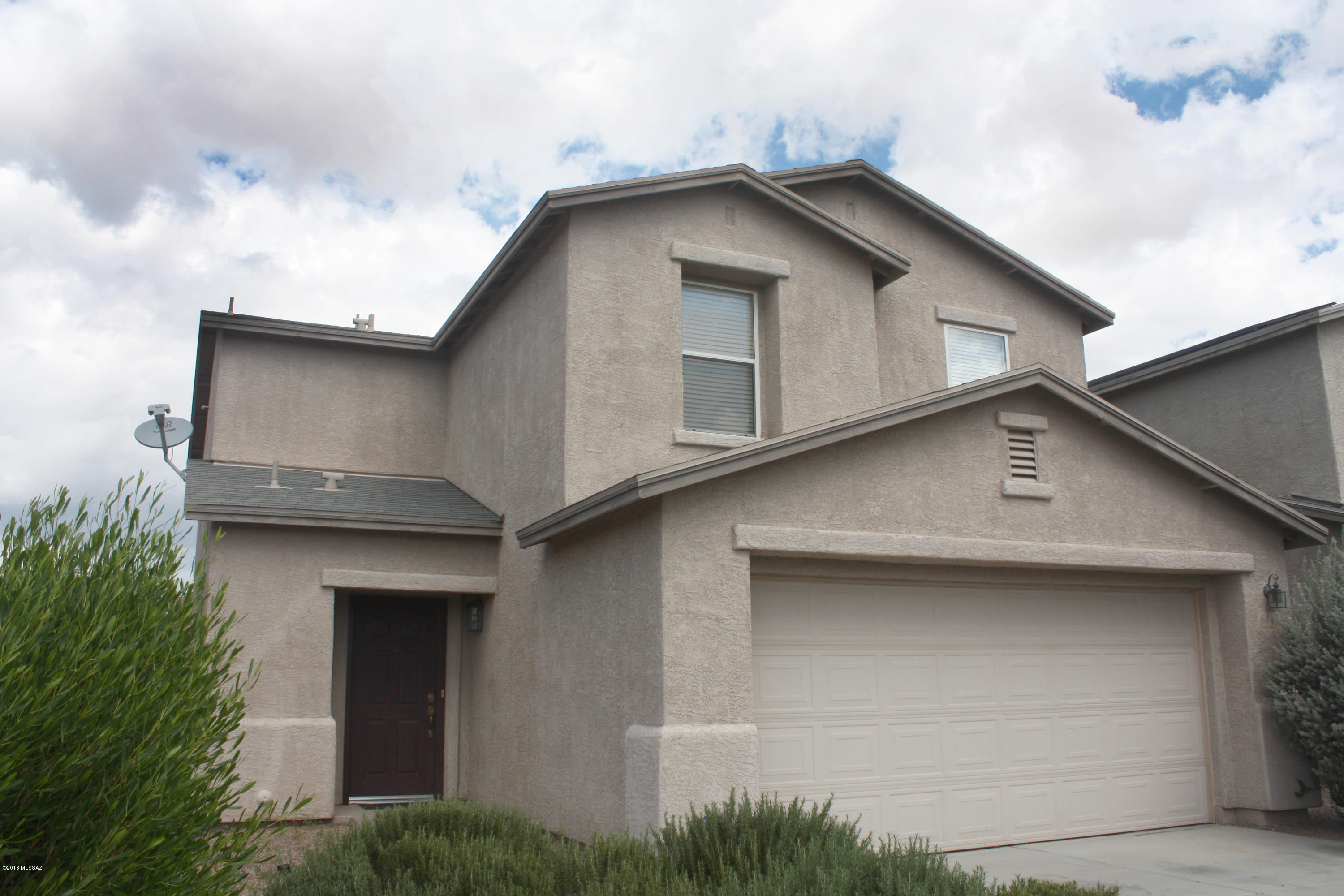 Open and Bright, this beautiful home is ready for new owners. Entire house interior has been freshly painted! Huge kitchen with lots of cabinets, counter space & a pantry! Beautiful ceiling fan fixtures throughout. New tile on entire first floor! New Carpet upstairs! Large loft space with potential for game room or additional living area. Lots of storage space throughout. Master bedroom features walk-in closet, double sinks and lots of space. Huge enclosed backyard, perfect for outdoor entertaining. Alarm installed & ready to be activated. Neighborhood features easy access to 1-10, DMAFB and Raytheon. Community park/picnic area & jogging path nearby.