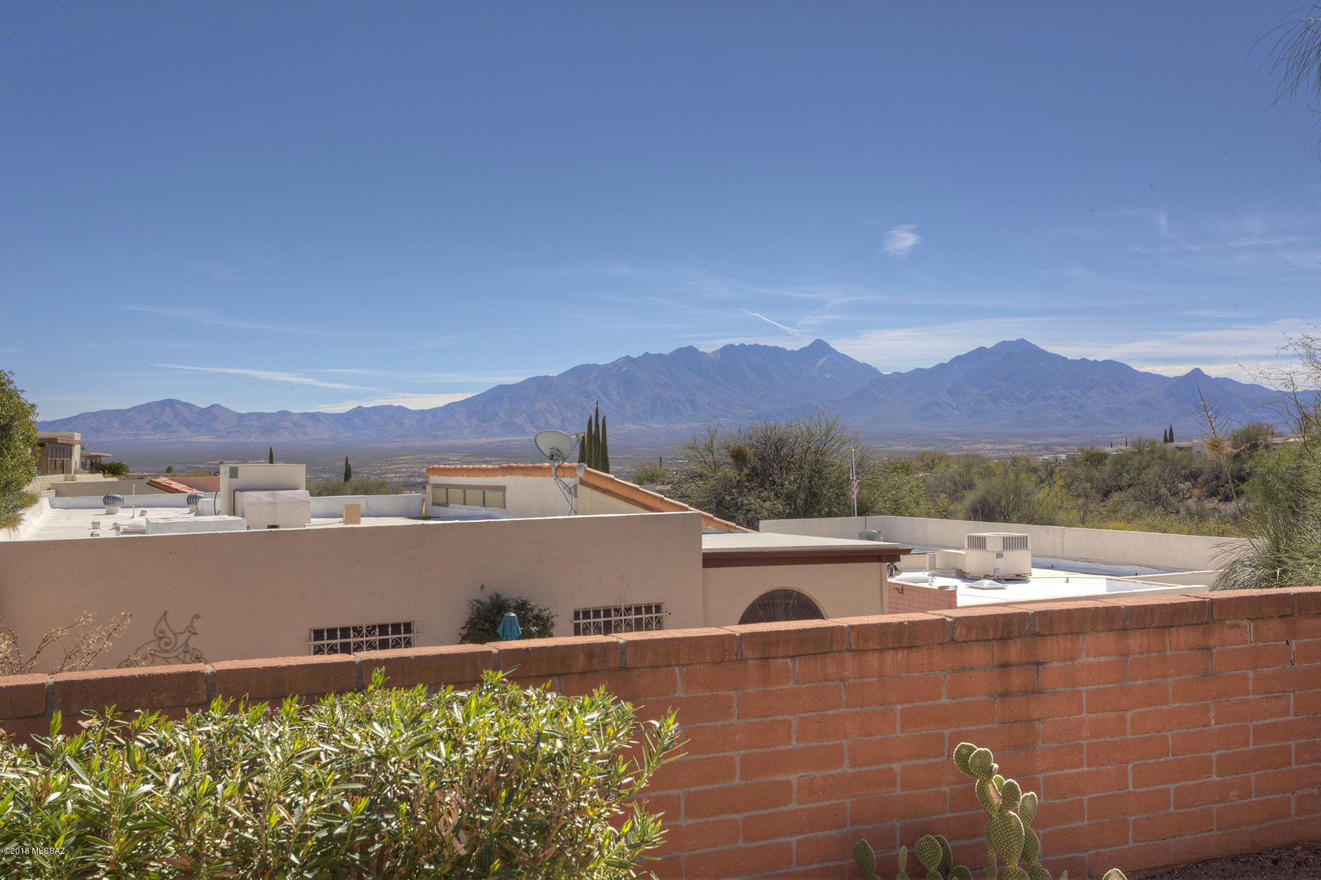 Wow! Is what you will say when you see the views of this place. Looking out to the east is spectacular Santa Rita mtn. views. Large private wrap around patio w/gazebo for your enjoyment. Desert landscaping including large saguaros for easy care.  Recently painted on the inside. New roof in 2016, & new HVAC unit in 2015. Kitchen has been updated and offers SS appliances, & granite countertop's. You don’t want to miss this beauty here in Green Valley. Priced to sell.