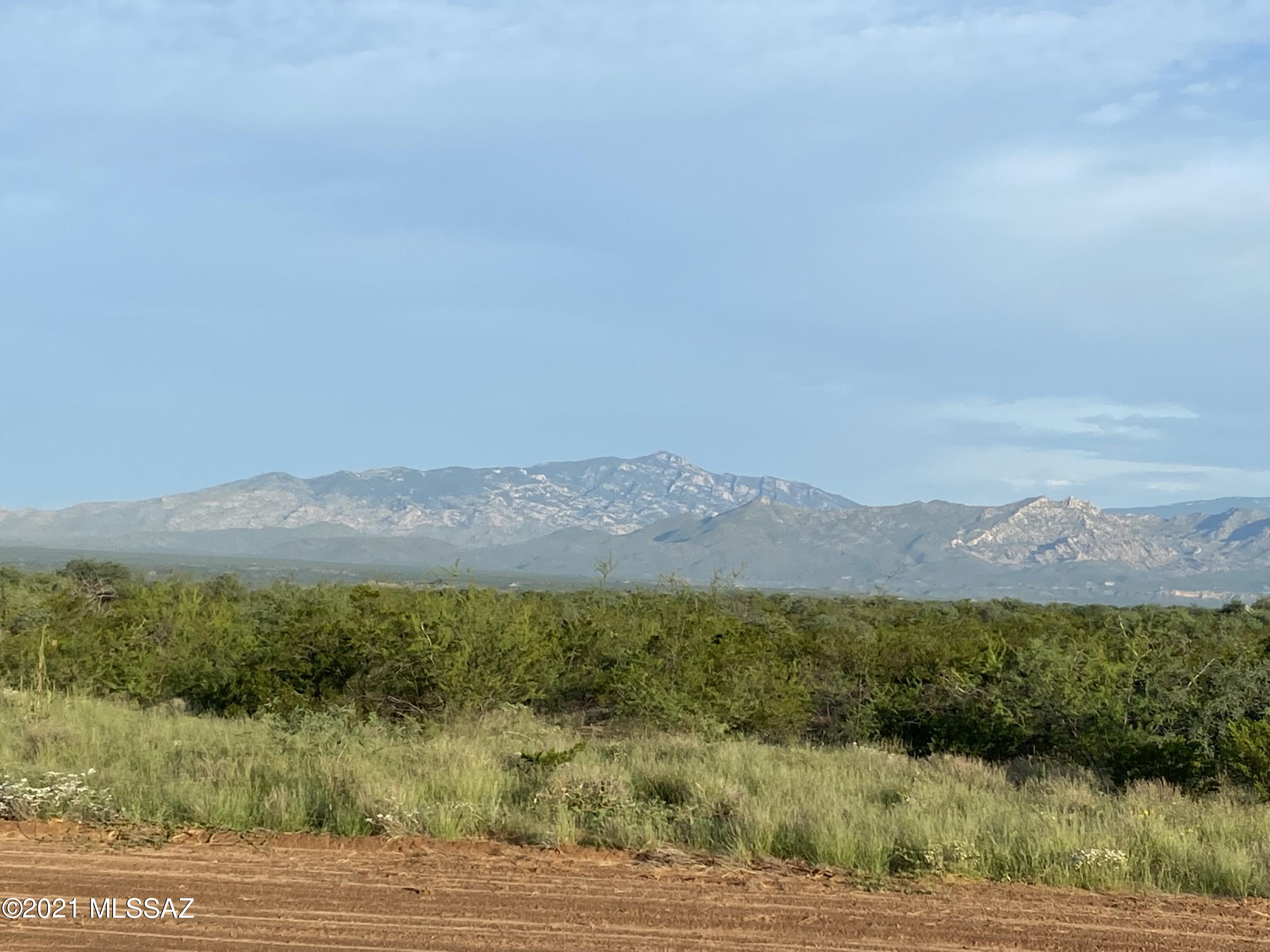 36.74 beautiful acres in fantastic location. A quick 10 min drive to I-10 and down town Benson with strong well drilled in 2021, see well detail in documents. Mountain views galore from the cleared home pad. Plenty of flat land with a slight drop into a pretty canyon and wash to explore. Enjoy the starry night skies, gorgeous Arizona sunrises and sunsets on your own property! 45 minutes to Tucson make this close enough to access all your needs but far enough away to be in the country! Site built homes only with an HOA for road maintenance. Listing agent & broker are related to seller.