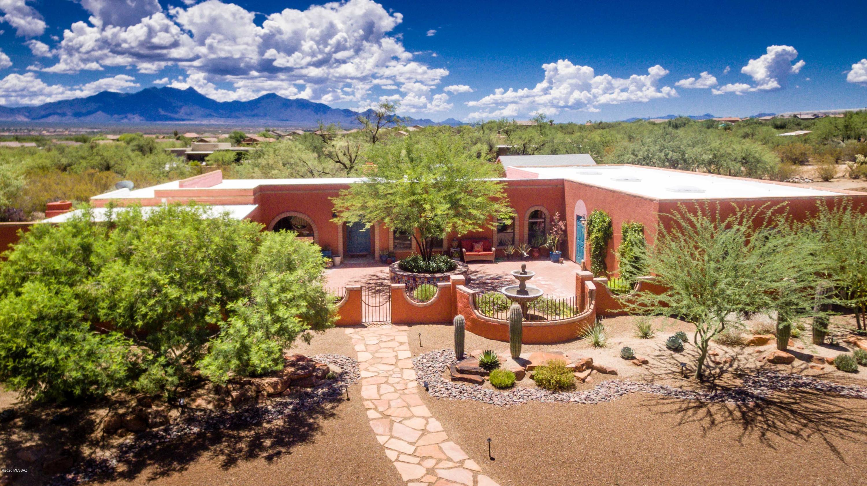 FANTASTIC CUSTOM BUILT HOME resting on nearly 1 ACRE cul-de-sac lot with NO HOA!  Excellent location in NON-AGE RESTRICTED neighborhood with tons of space for toys, boats and RV's. Enjoy a relaxed and private way of living in this gorgeous 3 Bedroom home, offering a bonus room,  2 baths, 3 car garage and separate studio.  Light and bright open floor plan with WOOD BEEHIVE FIREPLACE and TILE FLOORING THROUGH OUT. Ceiling in great room has WOOD BEAMS adding SW character. Lovely kitchen with QUARTZ COUNTER TOPS, breakfast bar, custom antique white cabinets, stylish back splash, new induction cook top and oven. Butler's pantry off of bonus room. LARGE BONUS ROOM features modern wood wall with electric fireplace, perfect as family room or man cave. Expend your afternoons at the wrap around porch with LOVELY MOUNTAIN VIEWS, built in BBQ, Kiva wood burning fireplace and low care desert landscape. Separate 280 sqft STUDIO can be used as office or hobby room. OVER SIZED 3 CAR GARAGE with extra space that can be used as shop or for storage. Additional shed building. All around a great home that shows PRIDE OF OWNERSHIP. Water bill set to $50 per month.