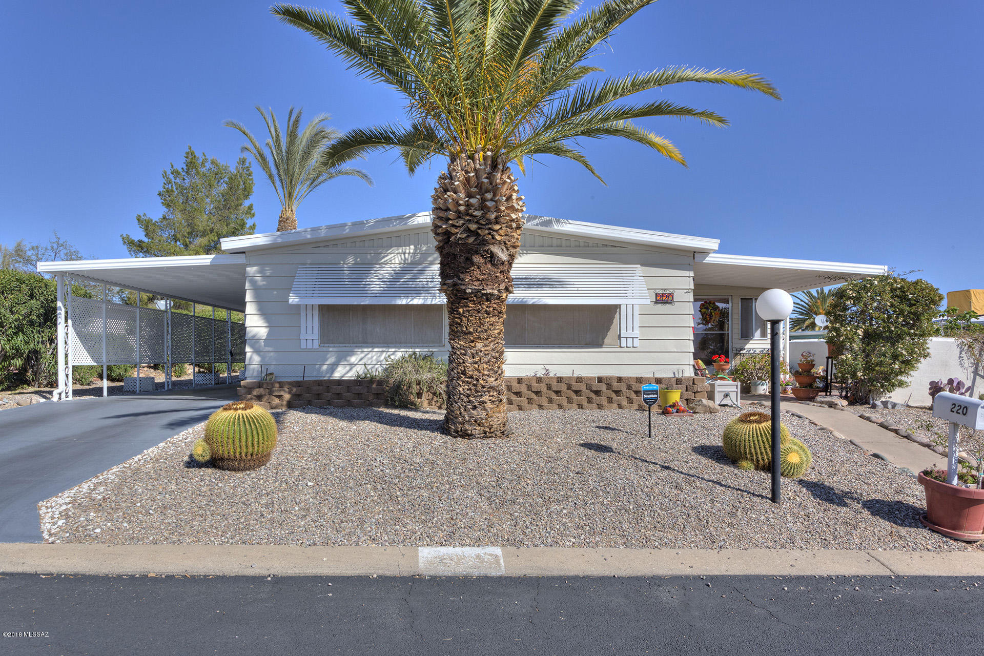 IMMACULATE AND INVITING, ENTER INTO THIS BEAUTIFUL HOME THAT HAS BEEN MAINTAINED AND LOVED. GREAT ROOM IS OPEN TO DINING ROOM; PLENTY OF NATURAL LIGHT.  GREAT MOUNTAIN VIEWS RIGHT OUT YOUR LIVING ROOM WINDOW. UPDATED FLOORING THROUGHOUT THE HOME. KITCHEN IS OPEN, ROOMY, UPDATED LAMINATE COUNTERS AND APPLIANCES, GREAT SPACE FOR IN KITCHEN DINING. ARIZONA ROOM IS ENCLOSED AND READY FOR ALL THOSE BEAUTIFUL SUNSET EVENINGS. BONUS WORKSHOP OFF ARIZONA ROOM. MASTER SUITE IS SPACIOUS AND ENSUITE HAS NEWER VANITY. GUEST BEDROOM W/HALLWAY BATH AND A LAUNDRY AREA; WASHER AND DRYER ARE INCLUDED.  PICTURE THIS HOME AS YOUR VERY OWN HOME; RIGHT IN THE HEART OF GREEN VALLEY. NO GVR, SPARKLING POOL AND REC CENTER.  LIFE IS GOOD IN GREEN VALLEY ARIZONA!