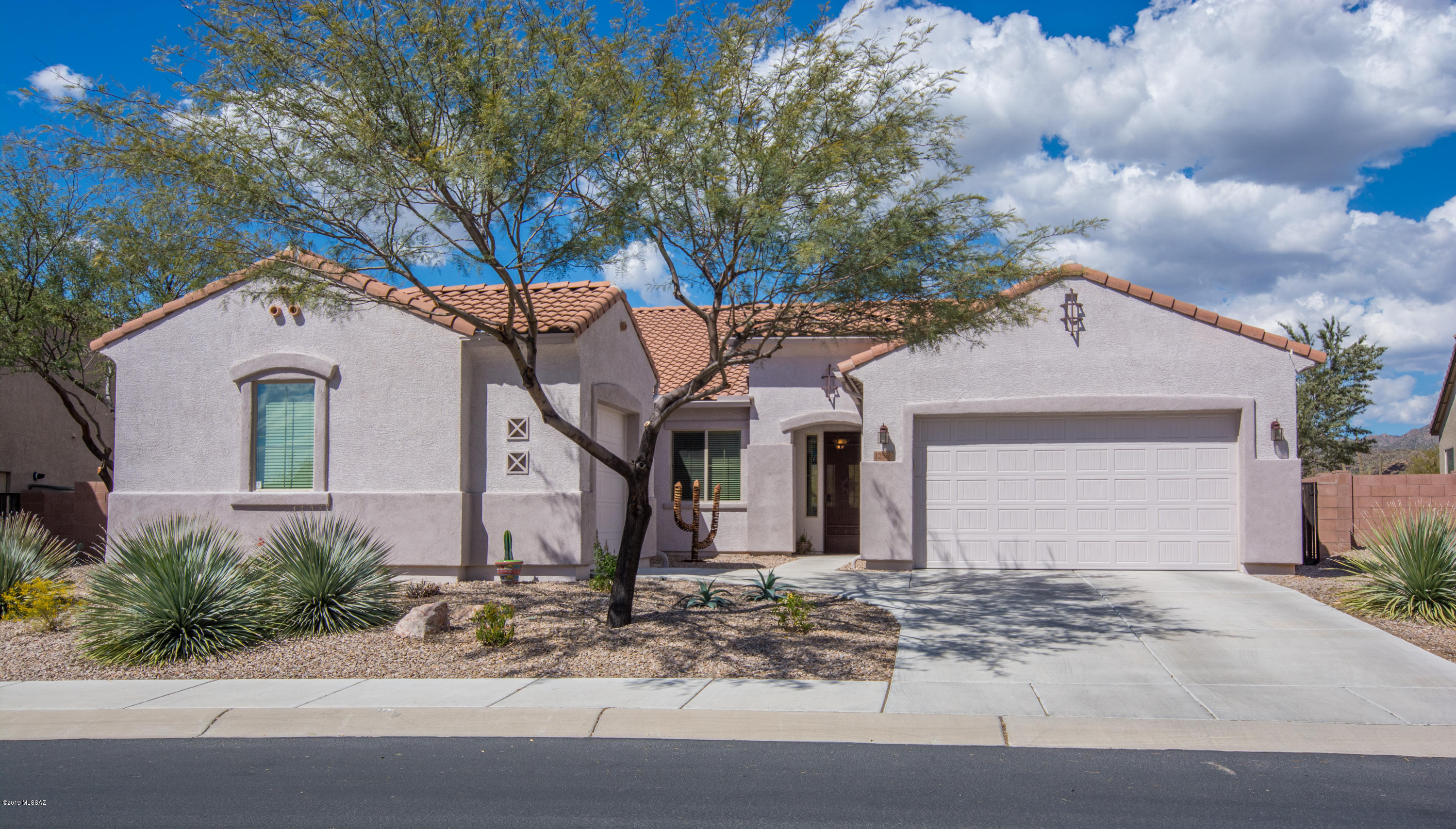 Gorgeous Tangerine Crossing one of a kind Maracay home on premium lot backing to desert for extra privacy! Expanded Verbena plan features foyer entrance, Great Room overlooking the back yard, Gourmet Kitchen with SS appl, double ovens, gas cooktop, granite counters, breakfast bar island and Eating Area with incredible views. Master Bedroom with ensuite bath - garden tub, sep shower, extended dual vanity, separate makeup vanity & huge Walk In Closet. Lovely Guest Bedrooms and Guest Bath with Walk In Shower & Extended dual vanity. Den off Great Room with double doors makes a wonderful home office or music room. Laundry Room has cabinets and built in sink. 2 Car Garage and separate insulated 1 Car Garage for a great home gym. The home is filled with upgrades in immaculate, move in condition!
