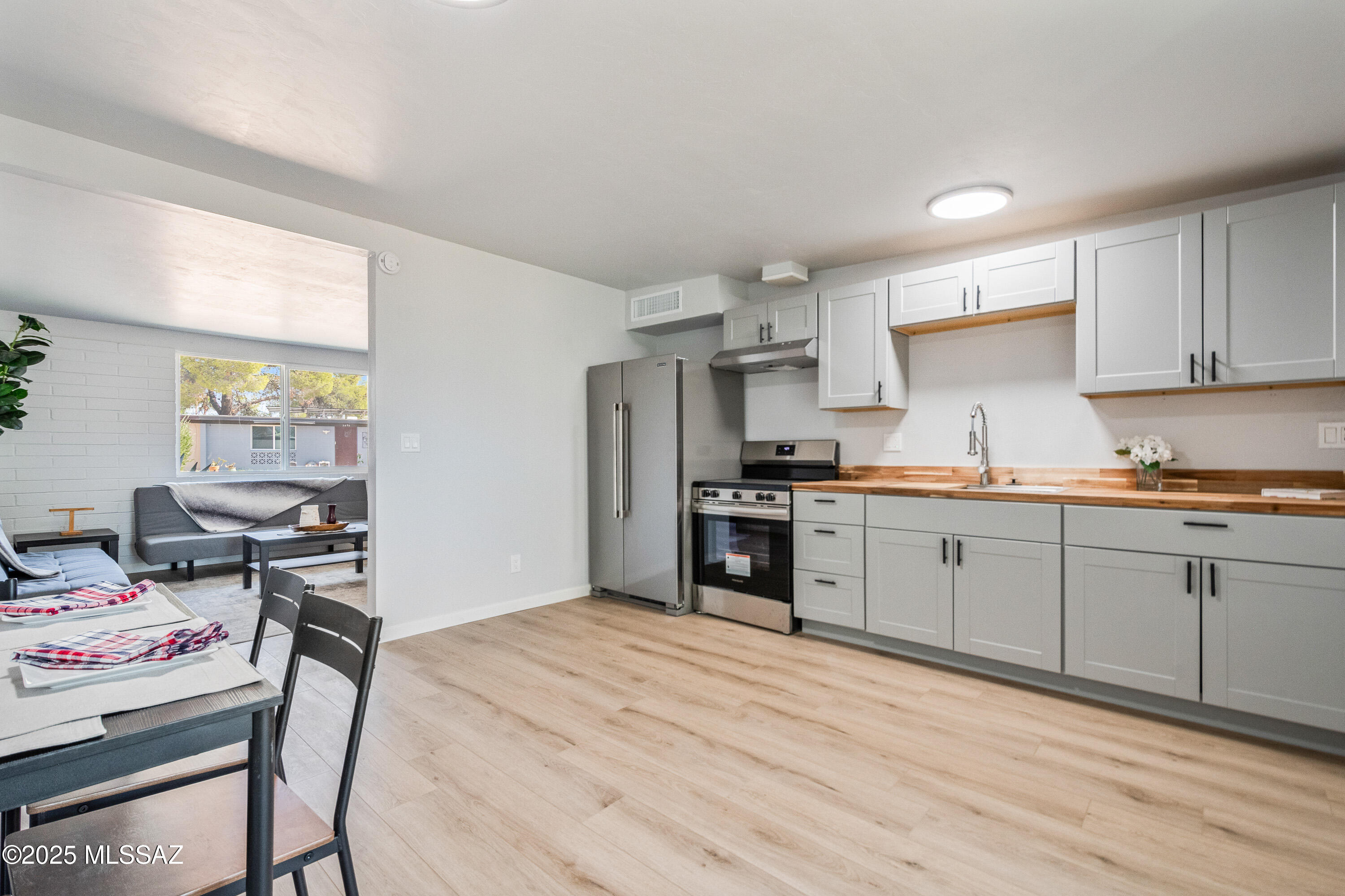 Completely renovated 2-bedroom, 1-bath townhome in desirable East Tucson, close to DMAFB, schools, shopping, and nature trails. This move-in-ready home features brand new AC, luxury vinyl flooring throughout (no carpet), and a modernized bathroom. Enjoy energy-efficient dual-pane windows, fresh interior and exterior paint, new cabinetry,  butcher block countertops, and stainless steel appliances. The property includes a separate laundry/storage room and a bonus room for added flexibility. The backyard provides a citrus tree and space for gardening. This home combines comfort and convenience in a prime location.