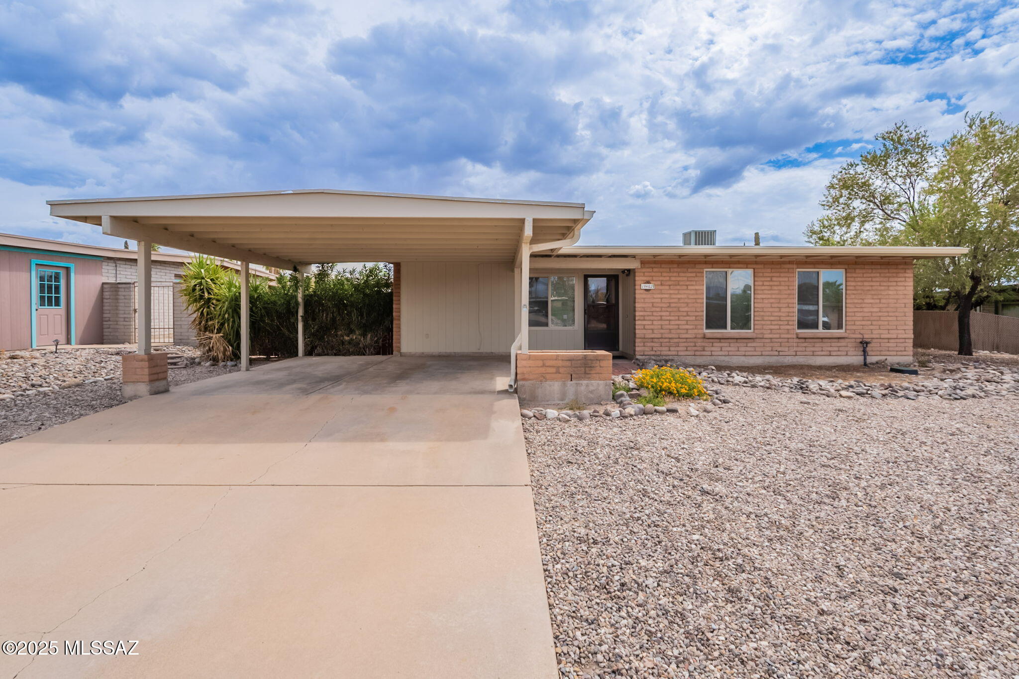 Estate sale opportunity for move in ready, all electric 3 bed/2 full bath 1,449 SqFt masonry Mid-Century ranch home, built in 1977 on .20 acre R-1 lot, detached 452 SqFt finished over height garage/workshop w/power, the freedom of NO HOA, in desirable Hearthstone Hills neighborhood located in East Tucson. Ideal for first time homebuyers, Air-BnB property, seasonal visitors, parents looking to secure student housing and investors alike! Featuring N/S orientation, single story, no stairs/no steps, front Catalina mountain views, spacious concrete driveway, space for RV parking, covered front carport, concrete sidewalks (seller is replacing section of front sidewalk), on and off street parking, metal gutters and low maintenance xeriscape front yard. 
Inside buyers will appreciate amenities, modern updates and including energy efficient double pane windows and sliders throughout, custom window blinds, copper plumbing, tile, carpet and Luxury Plank flooring, wood doors and trim throughout, Rheem HVAC, digital thermostat, new electric water heater 2019, water softener, ceiling fans, a remodeled kitchen with featuring Corian counter tops, recessed lighting, stainless steel appliance package including refrigerator (2021), dishwasher, electric oven, metal exhaust hood, pass through serving garden window and an eat in dining area, spacious bedrooms with updated full guest bathroom complete with full slab granite countertop executive height modern vanity, recessed lighting and tiled rain overhead shower/tub, and a primary bedroom retreat with ensuite updated full bathroom with full slab granite countertop executive height modern vanity, recessed lighting, modern in wall faucets and walk in tiled glass w/over head rain shower.
Enjoy tranquil Tucson sunsets under extended covered 1,078 SqFt backyard patios, native plants, mature orange and grapefruit trees, covered laundry room with washer & dryer included, 2X rain barrel cisterns, and gated alley access to 452 SqFt finished over height garage/workshop, all surrounded by masonry and wood privacy fencing.
Walking distance to Leman Academy of Excellence and Northwest Medical Center hospital, quick access to Houghton Road, minutes away from groceries/shopping/restaurants, short commute to Saguaro National Park Davis-Monthan Air Force Base and Raytheon. Call to make your appointment to view this affordable home today!