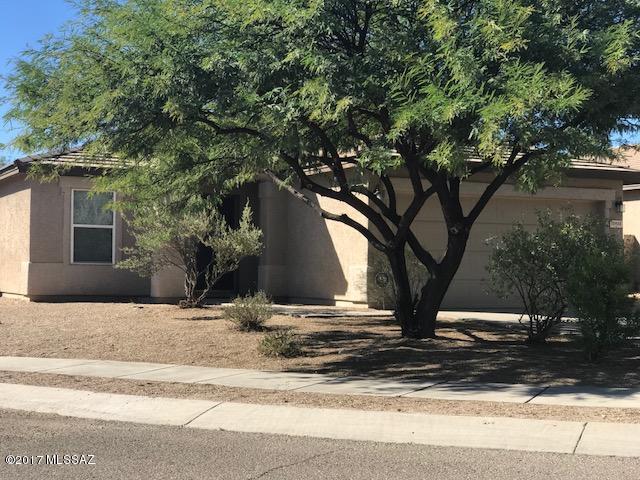 Great family home with split floor plan in Vail School District and located in much desired Mesquite Ranch! A/C,large living room w formal dining area, large great room off kitchen, eat in kitchen with range/oven, refrigerator, dishwasher, disposal, island breakfast bar, pantry. Easy care landscaping, covered patio and block fenced yard, dbl garage. Pool and BBQ area just down walking path from this home. Community has two swimming pools, basketball court, sand/volleyball & tether ball court, playing fields, 3 playgrounds, walking paths and BBQs.