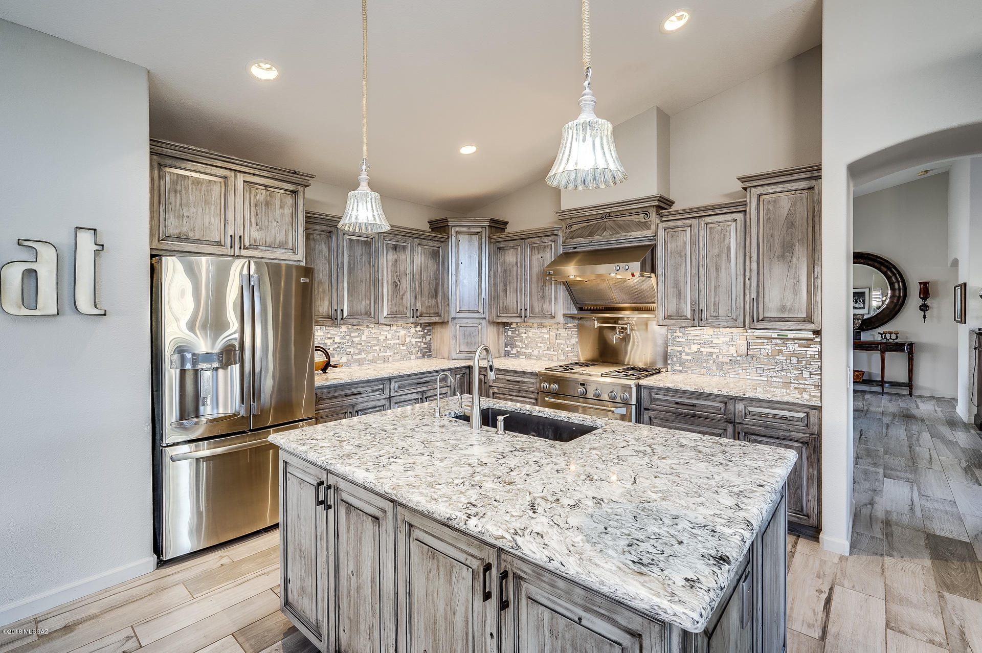 Magnificent Remodeled Montana model on Golf Course. Enter this 2 bd rm + den (2,277 sqft) with stunning Greigio Porcelain hand scrapped floor tile. Living, Dining and Kitchen rooms are Open (No Separating Walls). Lg wdws with Solar operated blinds offer Panoramic Golf Course Views. Gourmet Kitchen features GE Monogram appliances w/ Pot Filler, Quartz counters, Blanco composit dual sink with Moen Motion Senored water faucets. Breakfast/Cocktail Bar, Buffet Counter and Wine Cooler.