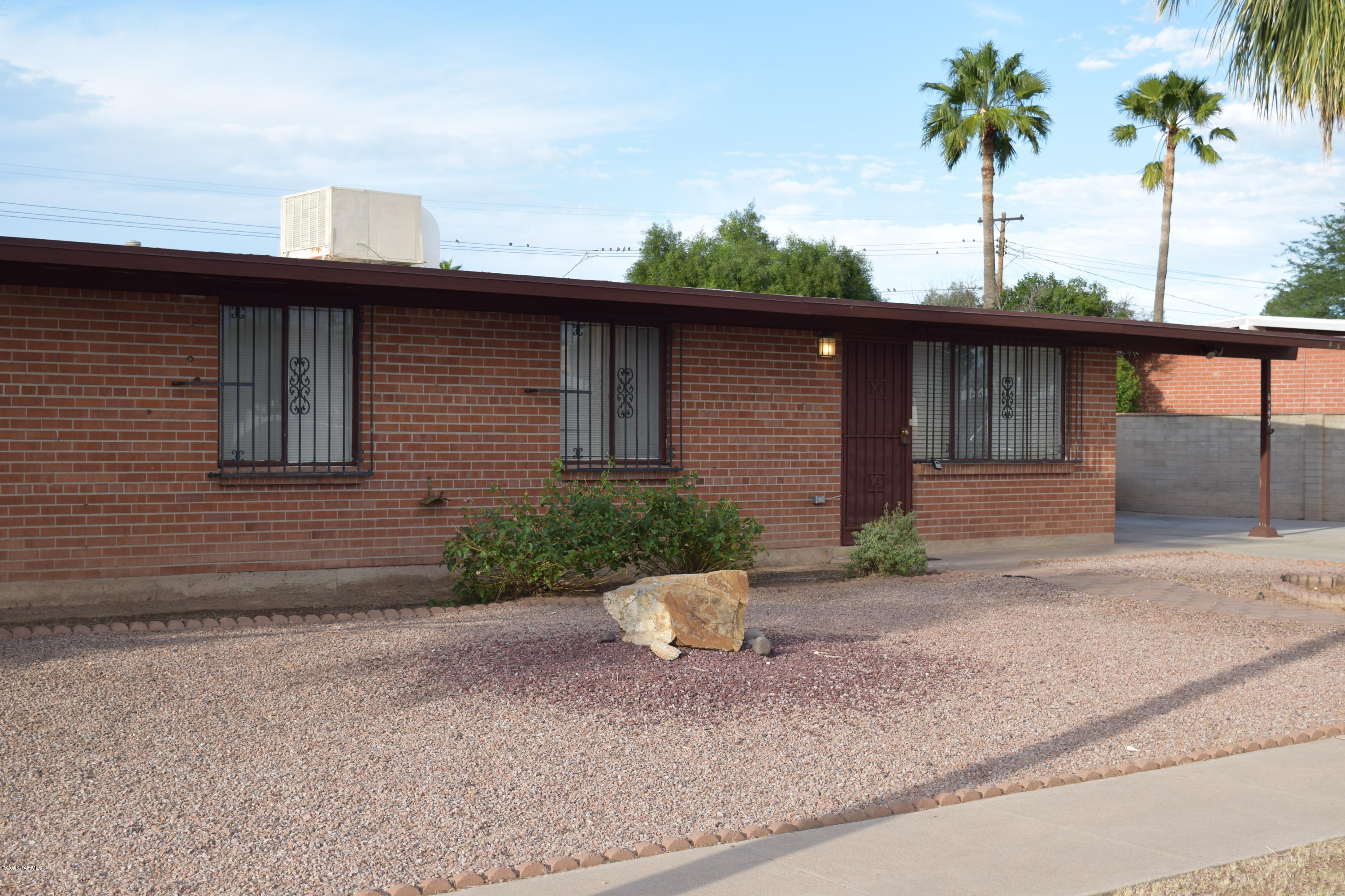 Charming East Tucsonl 3bed/2bath move-in ready home! Freshly painted inside and out! Roof also has new roof coating! This home has a nice open kitchen with oak cabinets, water softner, updated tile flooring,security wrought iron, large enclosed Arizona room and a huge back yard with tons of storage & great views of the Catalinas!  Close to shopping and a few miles from the U of A.