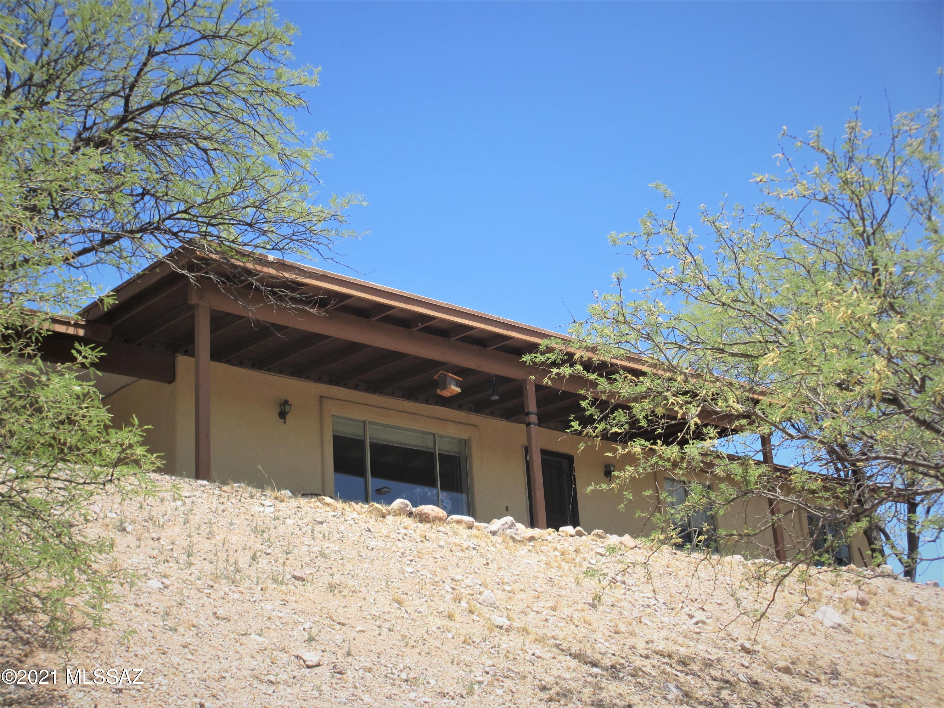 A very nice custom built home on the west side of Rio Rico !!  This home features ceramic tile flooring throughout, nice spacious kitchen, large family room and dining room, 2 patios... and much, much more!!...  Lots of privacy !!  There are spectacular views of the valley and mountains !!