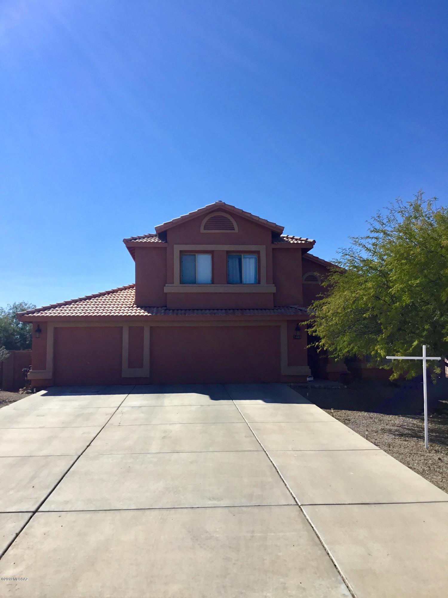 Enormous 5 bedroom 3 bath home located near entertainment, Casino Del Sol and AVA Amphitheatre, sits on almost an acre lot with East/West exposure, is a must see. This beautiful and well maintained home features tile as well as wood laminate floors, newer lighting fixtures, ceiling fans, 3 bay windows, maple cabinets with roll-out's and cellular shades. New paint inside and out. You'll enjoy the serene sunsets and mountain views on the extensive deck. This home is priced to sell, see it today!