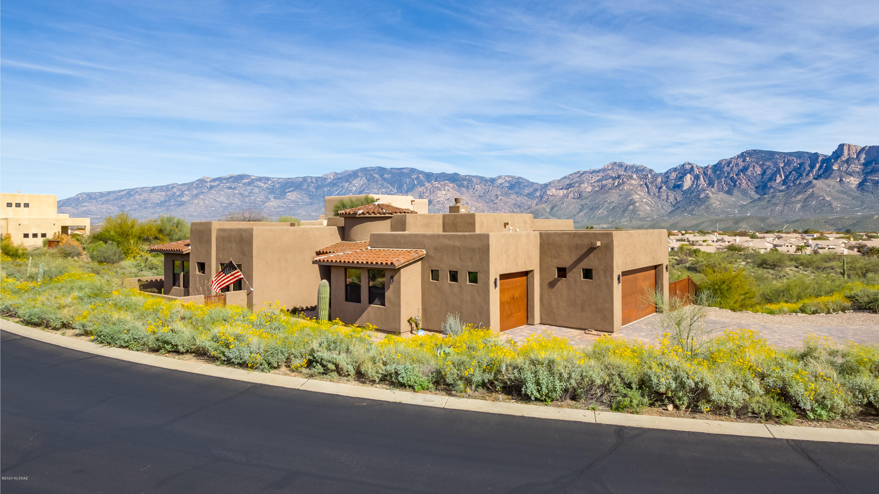 Incredible mountain & city views abound on this fully custom 1.48 acre 5 bedroom retreat! Culinary kitchen boasts executive granite island, soft close cabinets, dual-zone  chiller, 6 burner stove w/pot-filler, double-oven & walk-in pantry. Master suite has dominating panoramic views, slider to covered patio, dual vanities, rain shower, soaking tub & custom closets. 13' tall great-room has wood/gas fireplace & 12' breath-taking day and night view windows.  Flex room leading to bedrooms is great as teen hang-out or office. Covered patio w/pavers & path to custom multi-level patio/BBQ area is perfect for sunset & city lights. Grey water recycling, RV full-service hookups & solar prepped. Oversized 3-car garage w/ 220v service perfect for workshop.