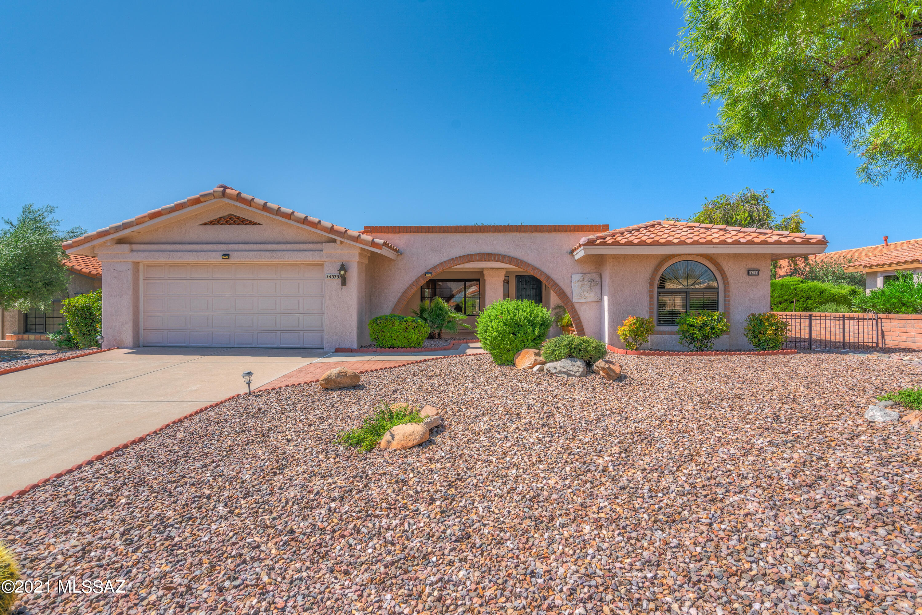 Beautiful 2BD/2BA (1,524 sq ft) Silvercreek plan in Sun City Oro Valley boasts formal & informal living, newer roof and HVAC, plus tranquil rear yard with Catalina views! Arched courtyard entrance flows to formal living & dining room with soaring cathedral ceiling. Open concept Great room beyond boasts a U-shaped kitchen with stainless appliances and breakfast nook with bay window. Large Master suite offers a bay window, walk-in shower and walk-in closet. Full hall bath, large laundry room, plus extended garage with storage cabinets and utility sink. Sprawling rear yard boasts a covered patio with extended brick pavers, citrus & shade trees, plus majestic mountain views. Sun City active adult community features a clubhouse, golf course, fitness center, pool, library & artisan center.