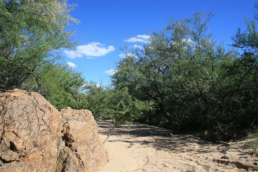 Range Priced: “Seller will accept or counter offers between $49,900 & $200,000.Exceptional Rural Homesite.Zoning allows 2 homesites.It can be split into two 4.13 acre lots. Underground Utilities, Private Well Share. Very Private area surrounded by 1000's of ac. state & federal land.  Dead end rd-no pass through traffic. 50 plus acres available. Potential Gated Community just add gate. Exceptional Permaculture self sustainable living opportunity.  High 3800'elevation is about 1400' above the tucson valley & cooler then tucson by about 10degrees on average.  High Foothills lot w/views all the way to the catalina mountains, Tucson city Lights, Santa Rita Mountains to the East &Sierrita Mountains to the West.Huge mature Mesquite trees border both ends of this land.13 total homesites potentia