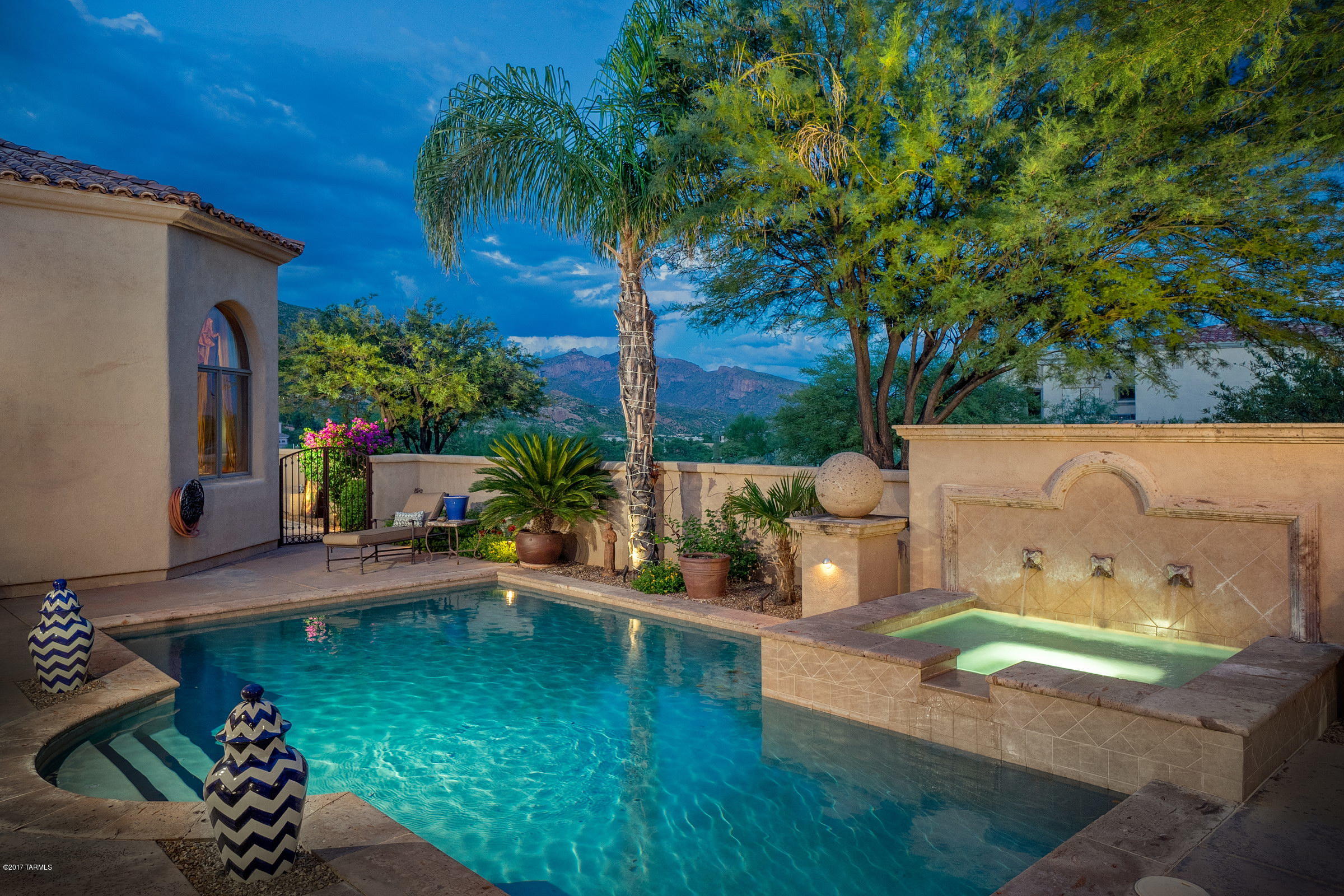NESTLED WITHIN THE PRESTIGIOUS ALTA VISTA COMMUNITY, PRESENTS AN OASIS OF SERENITY, LUXURY & UNWAVERING ATTENTION TO DETAIL. THIS STUNNING MEDITERRANEAN POSSESSES A REFINED OLD WORLD CHARM, FELT IMMEDIATELY UPON ENTERING THE HOME. TAKE NOTICE OF THE DRAMATIC CEILING HEIGHTS, W/ NATURAL LIGHT FILTERING THROUGH AN ARRAY OF LARGE PICTURE WINDOWS, FRAMING THE CATALINA MTNS BEYOND. MOVE PAST THE FOYER TO FIND THE GRAND SCALE LIVING, DINING, FAMILY ROOMS & GOURMET KITCHEN, FEATURING A 6 BURNER DACOR GAS COOK TOP, DOUBLE OVENS, 2 ASKO DISHWASHERS, FULL SIZED SUB ZERO FRIG/FREZER & WINE ROOM - IDEAL FOR ENTERTAINING FAMILY & FRIENDS ALIKE. THE MASTER SUITE CAPTIVATES, W/ ENORMOUS WALK-IN CLOSET, ENSUITE BATH W/ STEAM SHOWER, OVERLOOKING THE CENRTAL CRTYRD W/ POOL, ELEVATED SPA & OUTDOOR KITCHEN.