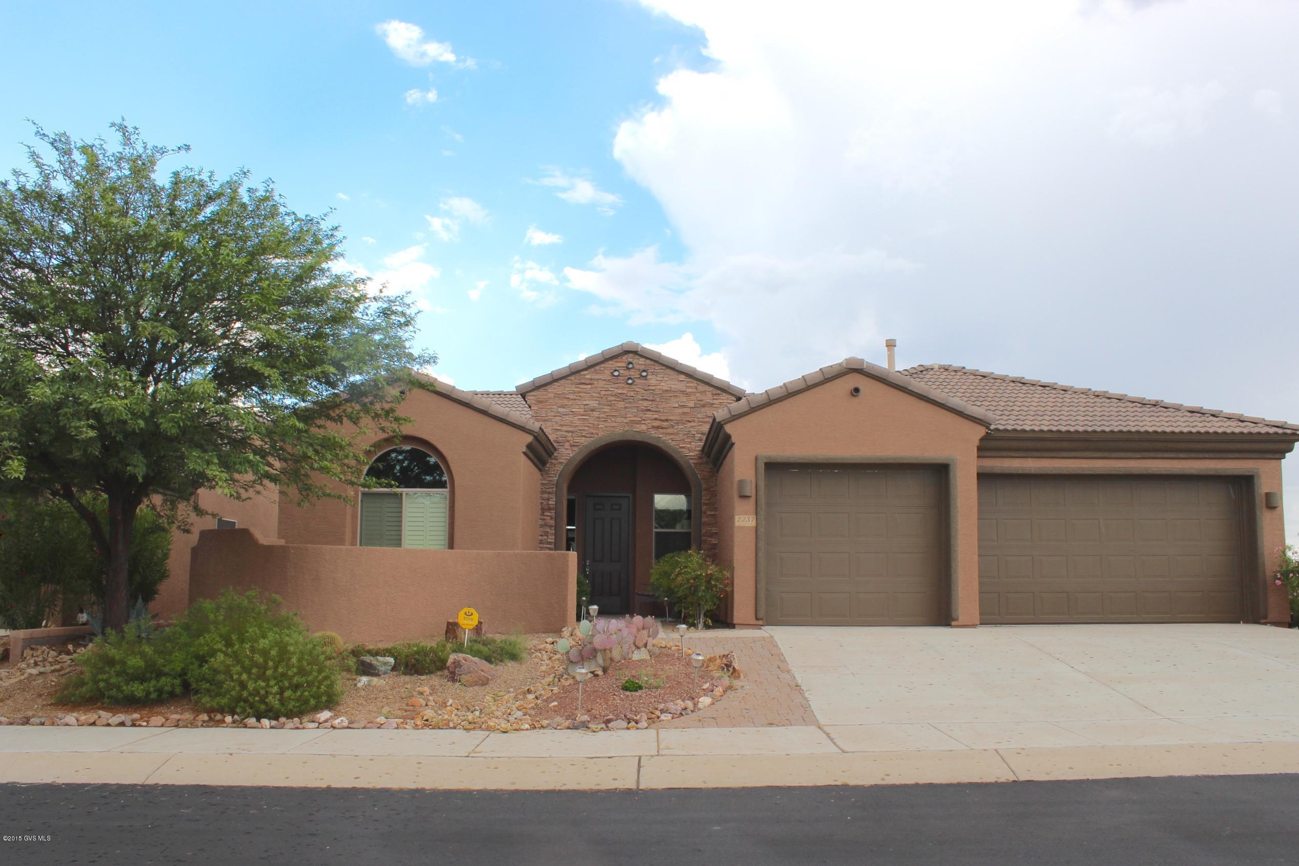 Nestled in a quiet cul-del-sac and backed with a beautiful setting of one of the most breathtaking golf courses in Green Valley! While you're out relaxing on your sun kissed patio, you will instantly feel like you have come home to a resort as you look out on the lushly landscaped grounds. Every evening the sunsets will beckon you to embrace the moment and capture the image of colors dancing on the desert mountains. Upon entry you will enjoy lavish upgrades like granite counter tops, plantation shutter blinds through out, gas log fireplace, pantry butler, reverse osmosis, elevated dishwasher, extra counter and cabinet space, an area for a den and formal dining for guests. The master suite is spacious & beautiful, 3 car garage offers extra storage. Walking distance to the community pool.