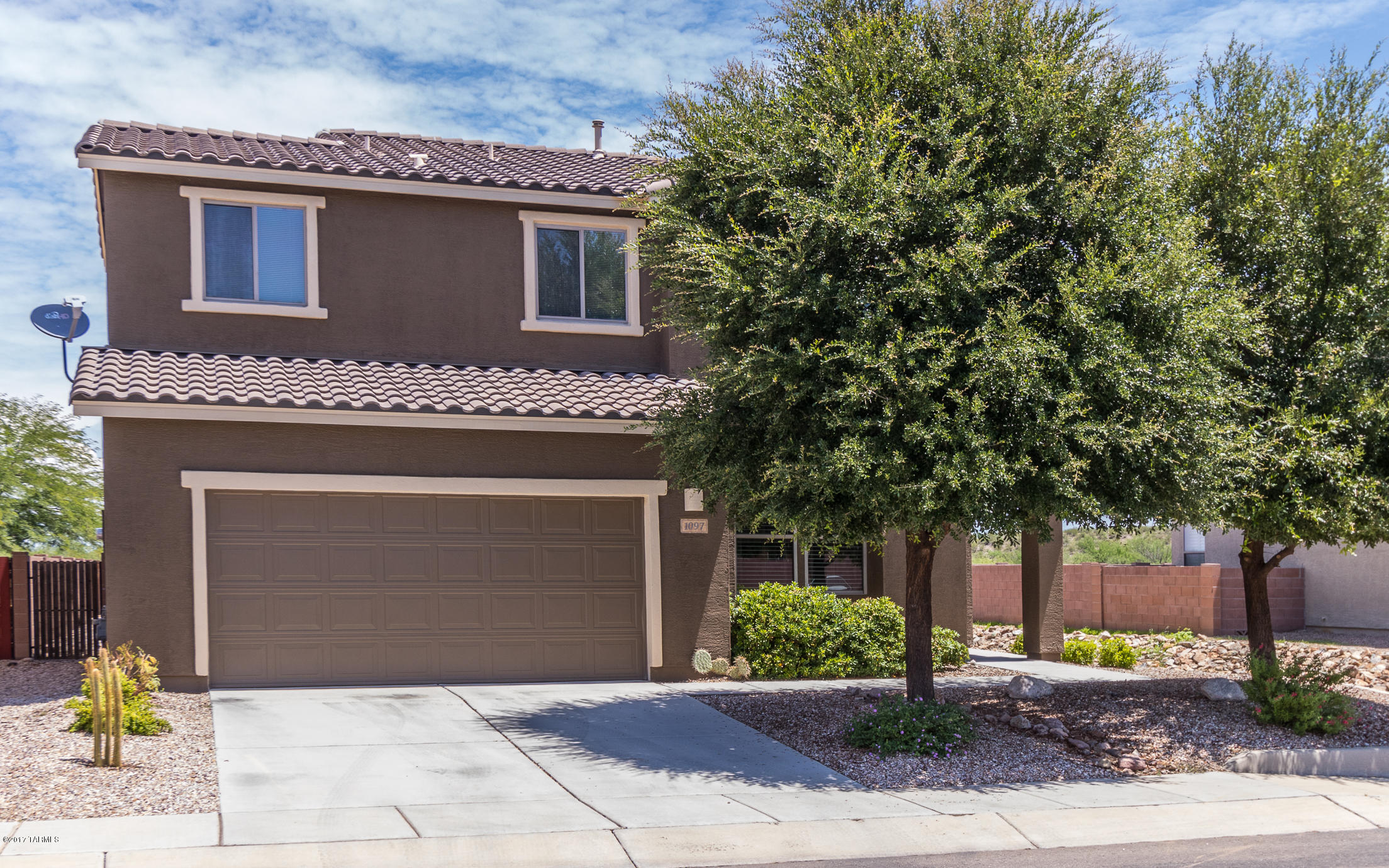Seller will consider offers between $200,000-$220,000. This 5 BR Meritage home is move-in ready. Enter into a large GR w/ kitchen & dining area directly behind. Your kitchen boasts Corian counters,cherry cabinets, ceramic tile, recessed lighting & island w/ sink & breakfast bar. Dining area overlooks the back yard. Downstairs BR w/ adjacent bath is ideal for guests or family members looking for a little extra privacy. Upstairs BRs have plenty of space for your oversized pieces & loft area can be used as play area, workspace or den. Best of all is the huge back yard, which is pool-sized & provides ample space for outdoor activities. Grill out on your covered porch, outfitted w/ one-way screens for additional privacy. With no homes behind & mountain views to enjoy, you'll want to spend lots of time here. Did I mention the exterior has been painted with special Stucco Restore paint, which means you won't need to re-paint for a long time. Versatile and easy care, this home is a great value! All you need do is pack & move in!