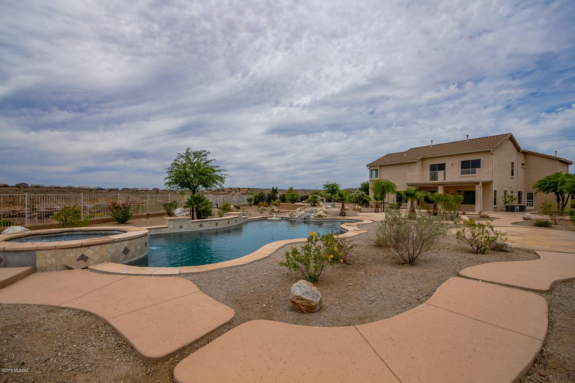 Truly a must see, spacious open home with updated kitchen, new flooring, enjoy evenings on the balcony overlooking breathtaking mountain views. Expansive lot ready for entertaining, lagoon style pool, with spa and rock water feature, raised seating area overlooking pool. Three car garage with ample storage and built-in work space. Owner/Agent.