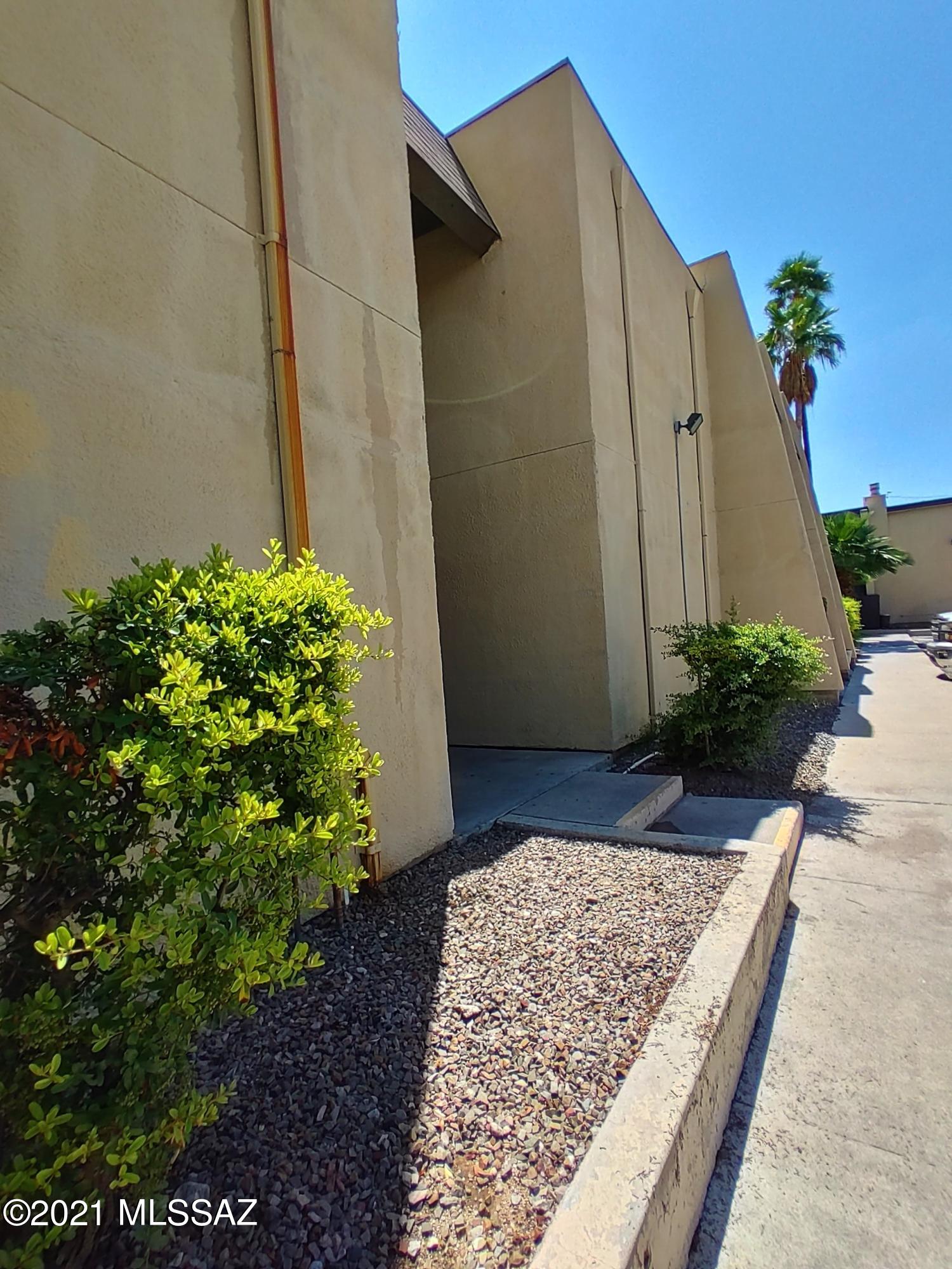 Adorable Condo in the heart of Tucson!  Walk in to this open concept floor plan to your spacious living room with natural light and access to your shady balcony. On the balcony is a fantastic mountain view! The kitchen over looks your dining / living areas and features beautiful cabinetry, tile countertops, stove, dishwasher and stainless steel refrigerator! Fresh paint, new garbage disposal, & new window in 2nd bedroom. In the hall you will find nooks for your decor, 2 enormous bedrooms and a jack & jill bath! Wonderful location so close to shopping, restaurants, the park mall, and less than 15 minutes to DMAFB and the U of A! The HOA fees cover water, including hot water, sewer, trash, exterior termite control, exterior maintenance, roof,  pools and common areas!