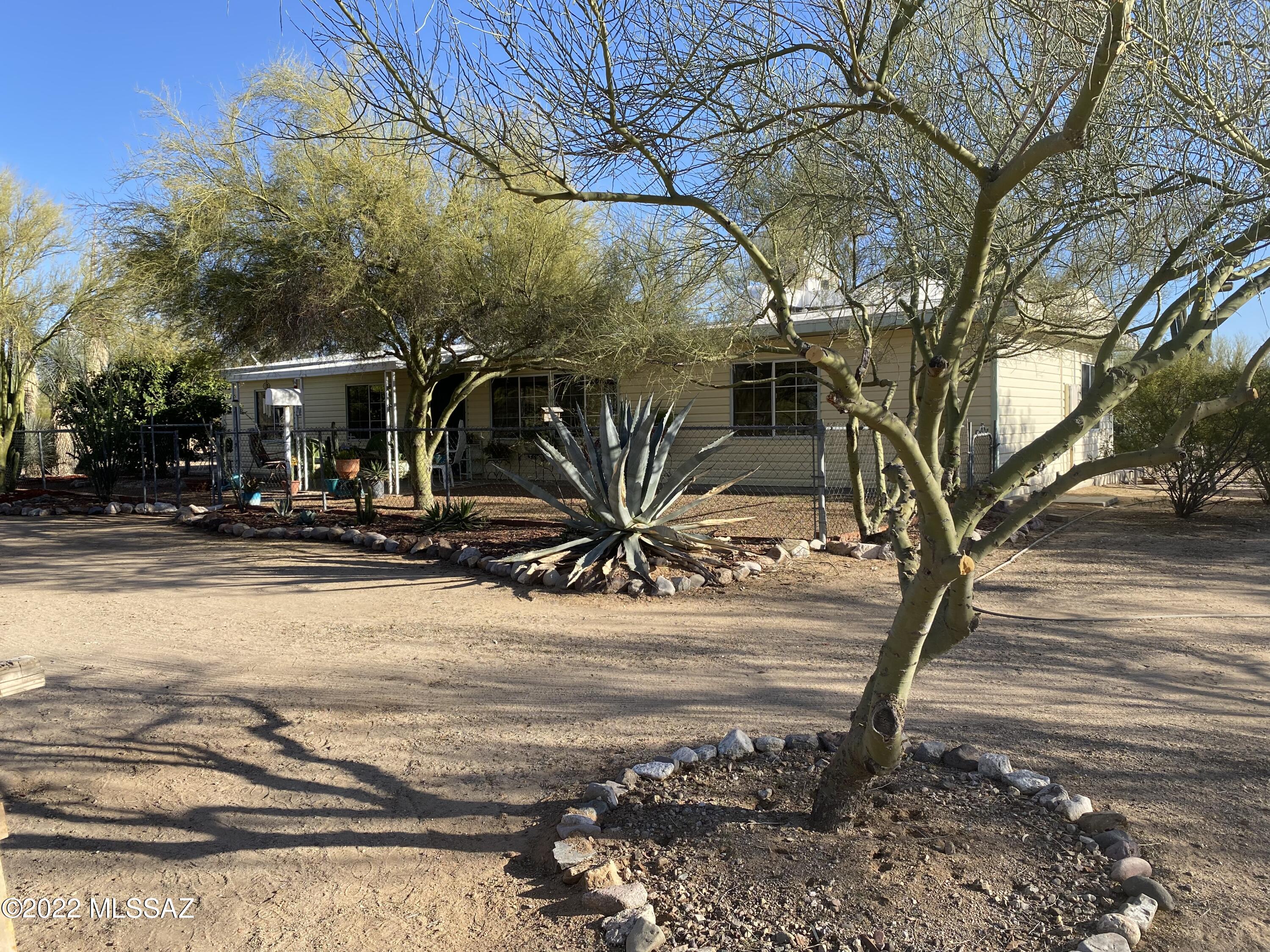Open House Sat 4/30 from 10am-12pm.
Beautiful mountain views with natural desert landscape in a quiet rural neighborhood. This 3 bedroom 2 bathroom manufactured home rests on 1.59 acres with a tranquil screened covered back porch addition, and no HOA. Entertaining made easy with this extra wide  lot or just bring the horses, boat and toys! This home is being sold in as is condition with motivated seller.