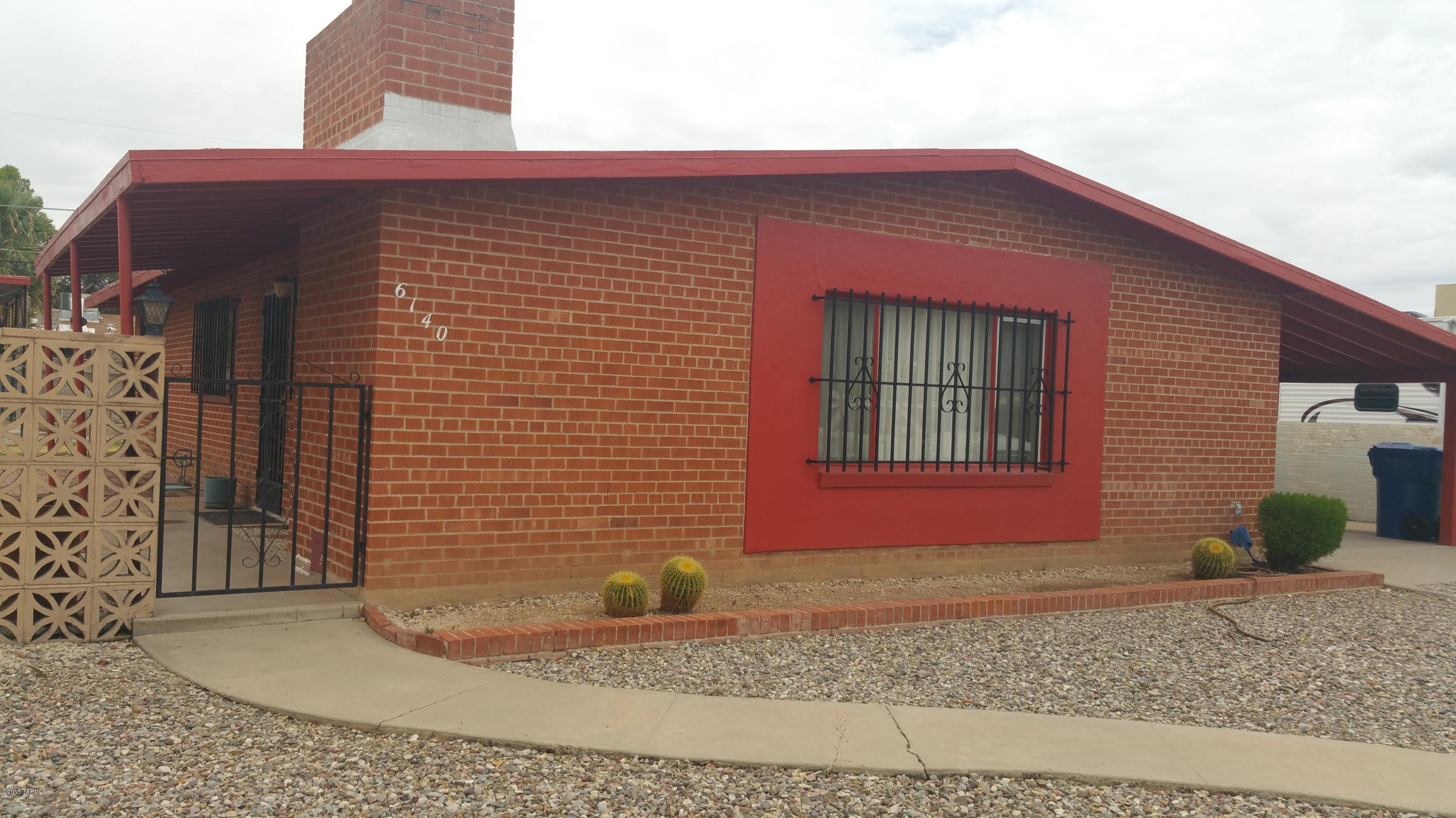PRICED TO SELL!! Solid brick house in Wilmot Desert Estates. Great location in the heart of the city behind Monterey Village Mall. House has open floor plan and family room with fireplace. 3-year new swamp cooler. Huge front yard away from main street traffic offers great potential or spacious parking for guests!