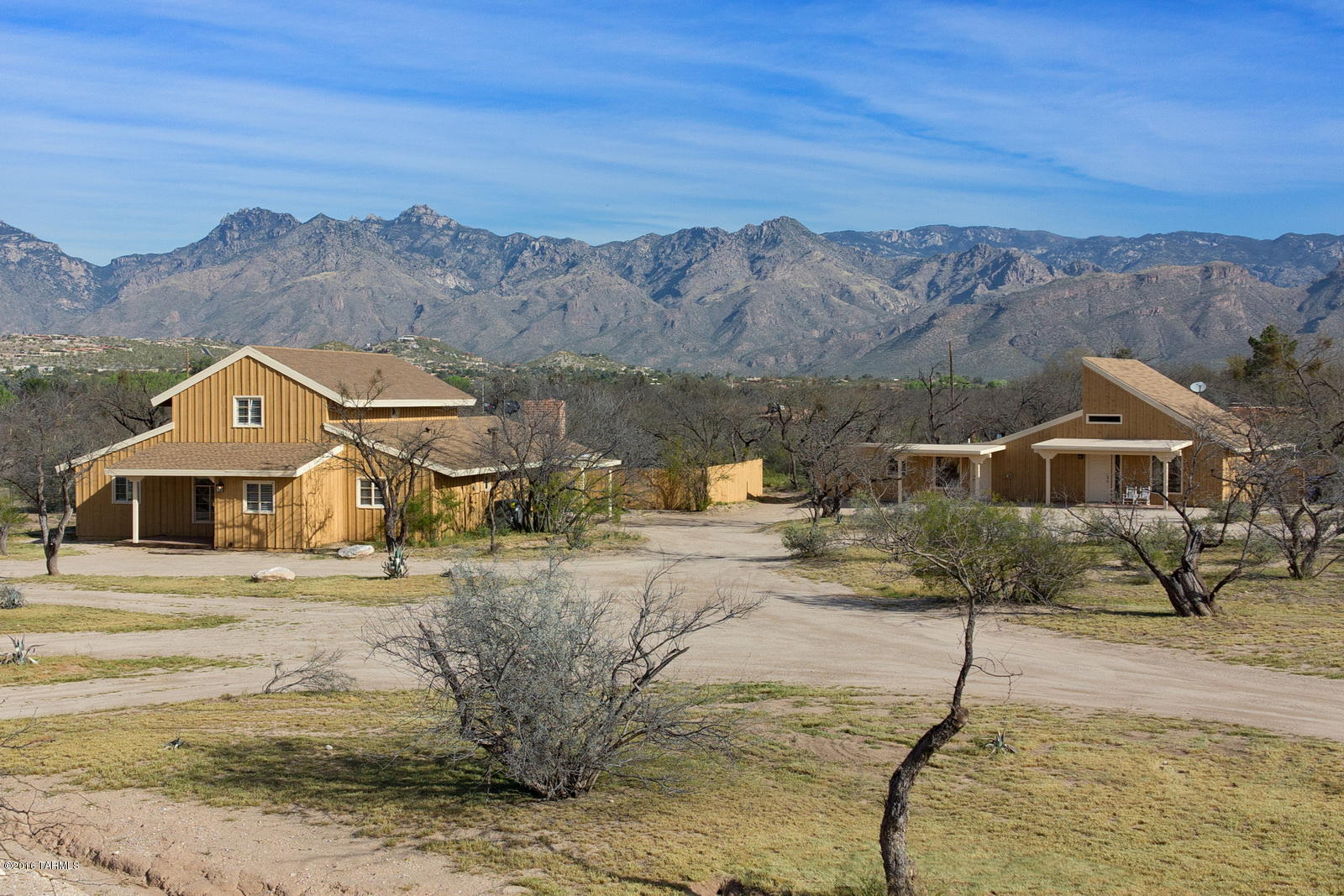 Your own ranch retreat is right here in town, surrounded by lush woodland, incredible mtn views & endless sunsets in this FULLY REMODELED home on 3.91 acres! 4 bd 3 ba 3,010 sf main house; PLUS 1 bd 1 ba guest house & 1 bd 1 ba casita plus stables. This one of a kind estate boasts original exposed rafter ceilings & rare adobe floors, enhanced with all new features. Fabulous new kitchen incl rich walnut counters, shaker cabinets & SS appl. all new baths, AC, roof, & cedar siding. Patio French doors look out to grass backyard w/rock-lined lagoon pool & spa. Guest quarters also beautifully redone. Add'l acreage for sports field or horse arena/pasture plus room for large paddock. Horse facilities have 3 encl plus 2 covered stalls w/runs and barn for hay & tack.
