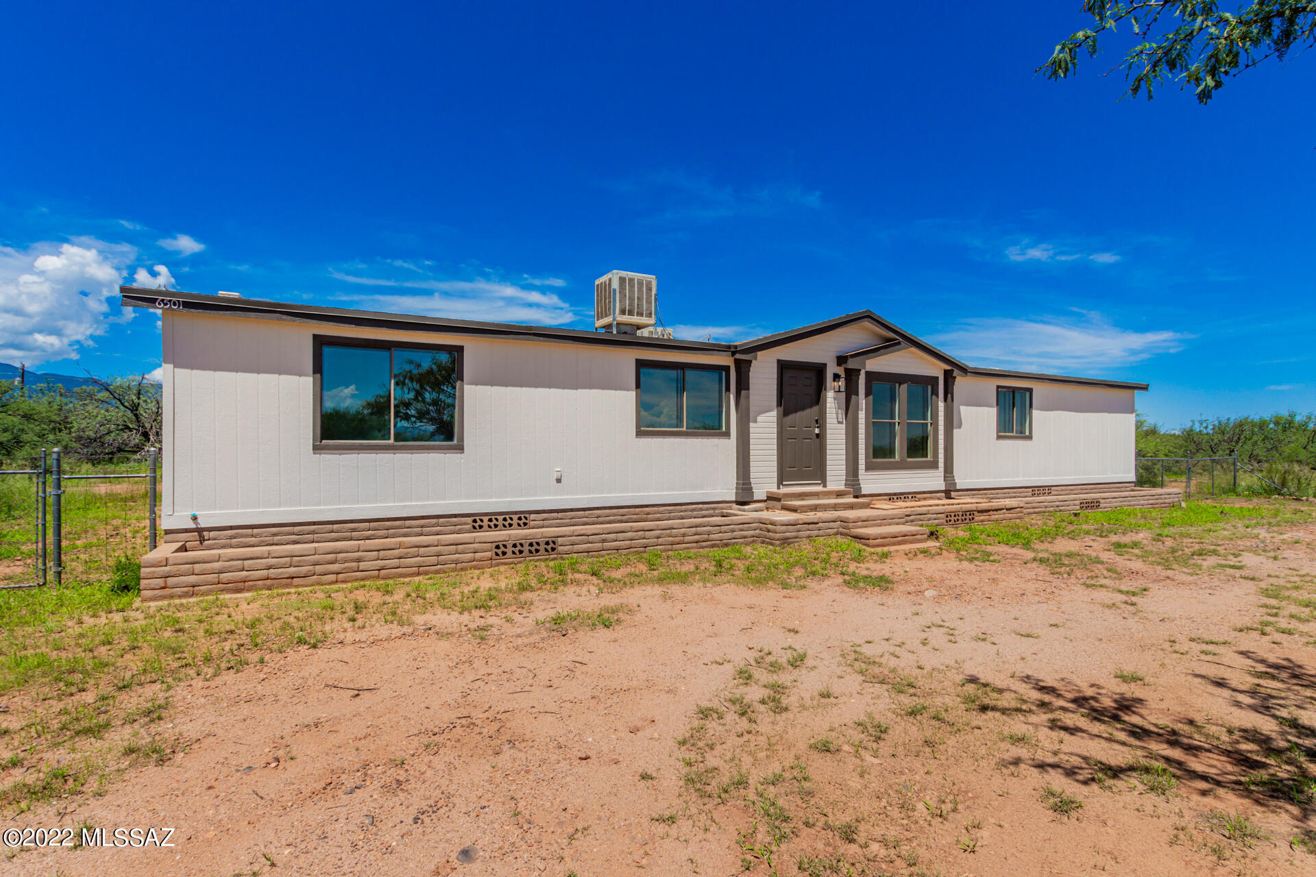 SELLER FINANCING AVAILABLE!  With $50,000 down, rate of 9.9%, your monthly P&I payment will be $1,305.29.  This move-in ready, AFFIXED home boasts vaulted ceilings, gorgeous wood-look flooring, BRAND NEW ROOF and a generous-sized living/dining room with bountiful natural light. The family room has sliding glass doors leading to the backyard. Master your cooking in the spotless kitchen showcasing recessed lighting, plenty of white cabinets, SS appliances, a skylight, & quartz counters. Relax under the covered patio in the expansive backyard with a separate storage shed while enjoying the refreshing nature & breathtaking mountain views!  Hurry Now!