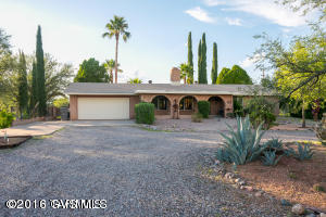 Cozy secluded ranch in Amado with over 2 acres of land! In front there is a 2 car garage, the porch has attractive archways, and there is RV space available. The living room has a stunning fireplace! The kitchen is open with ample counter space, lovely wood cabinets and an island full of storage drawers and cabinets! There are 3 bedrooms, and 2 bathrooms. One bathroom has a large walk in shower. The master bathroom has a relaxing soaking tub. Major Bonus is the HUGE finished basement! Out back is a beautiful oasis complete with covered patio, pool, large palm trees to make it feel like you're own personal paradise looking out toward gorgeous mountain and sunset views!