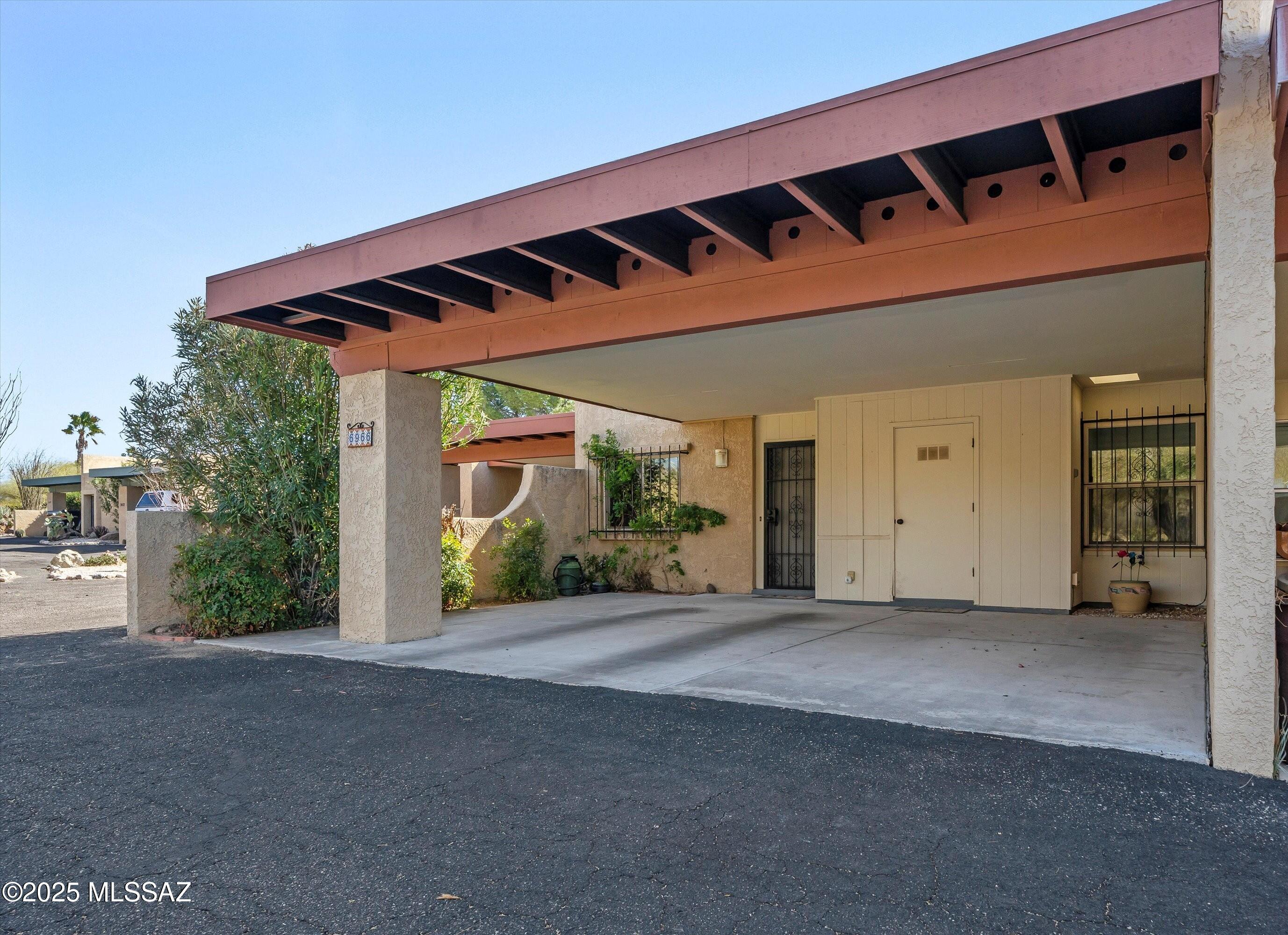 A rare find in the Foothills.  A lovely 1314 sq. ft. 2 bedroom 2 bathroom townhome in sought after Riverbend Estates near Sabino Canyon & Cloud Rd. This home offers ample storage and a spacious dinning/living area with tile or laminate throughout except carpet in primary bedroom. Oversized 2 car carport, private back patio with sliding glass door access to both living room and primary bedroom. Past updates include low-e windows, and laminate wood flooring. HOA dues include refuse collection, termite control, fire protection, common area landscaping, 2 community pools, spa, and lighted tennis courts. Enjoy low maintenance living near Sabino Canyon, Udall Park, shopping, restaurants, and more