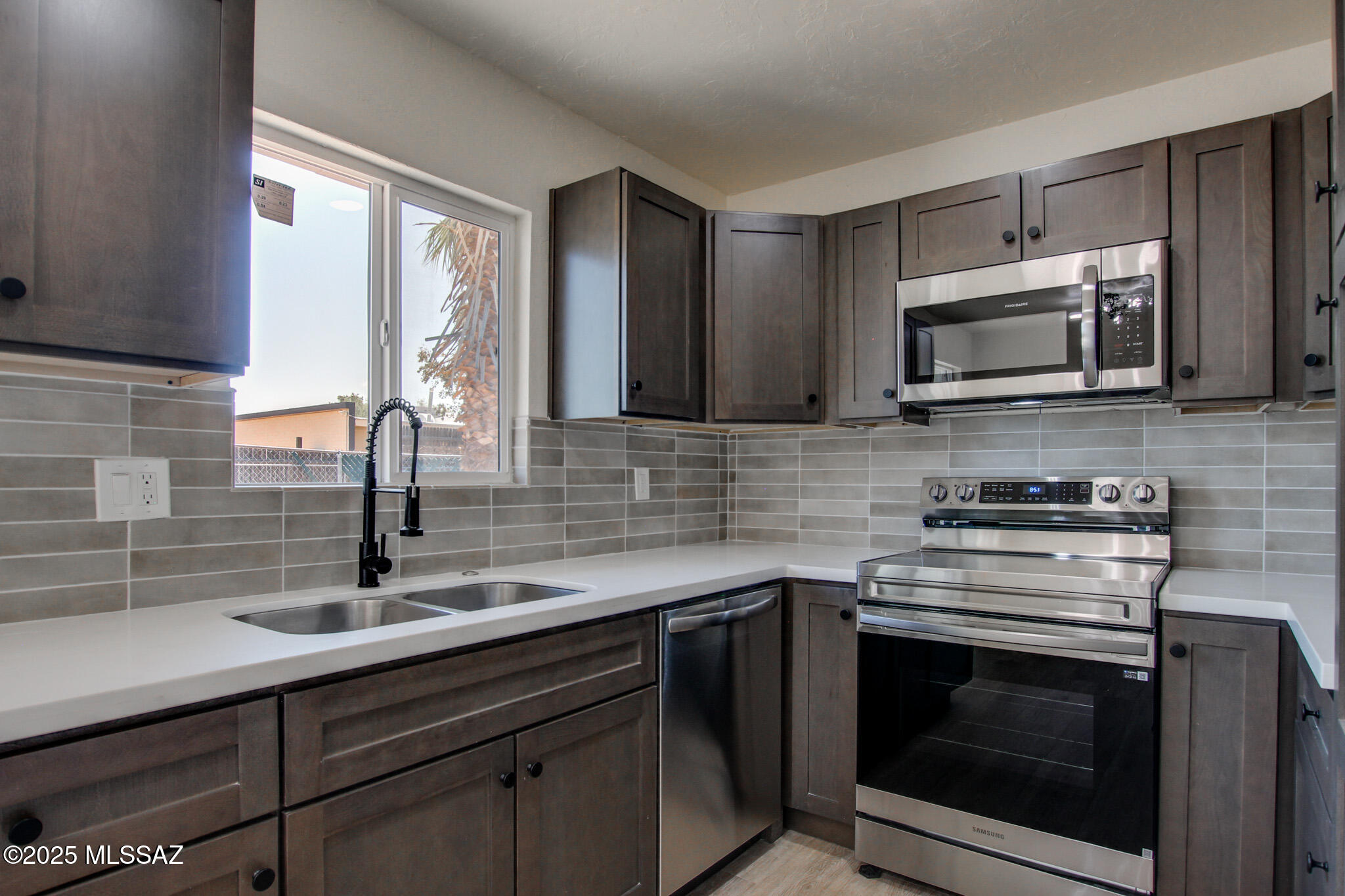 Now available! Townhome beautifully updated.   Inviting kitchen with warm brown cabinets, earth tone tile backsplash, Quartz countertops, stainless steel appliances, wood look luxury plank flooring and fresh interior paint.  Refreshed bathroom with stylish tile shower surrounds, new countertops, cabinets and modern plumbing fixtures. Located in convenient Eastside location.