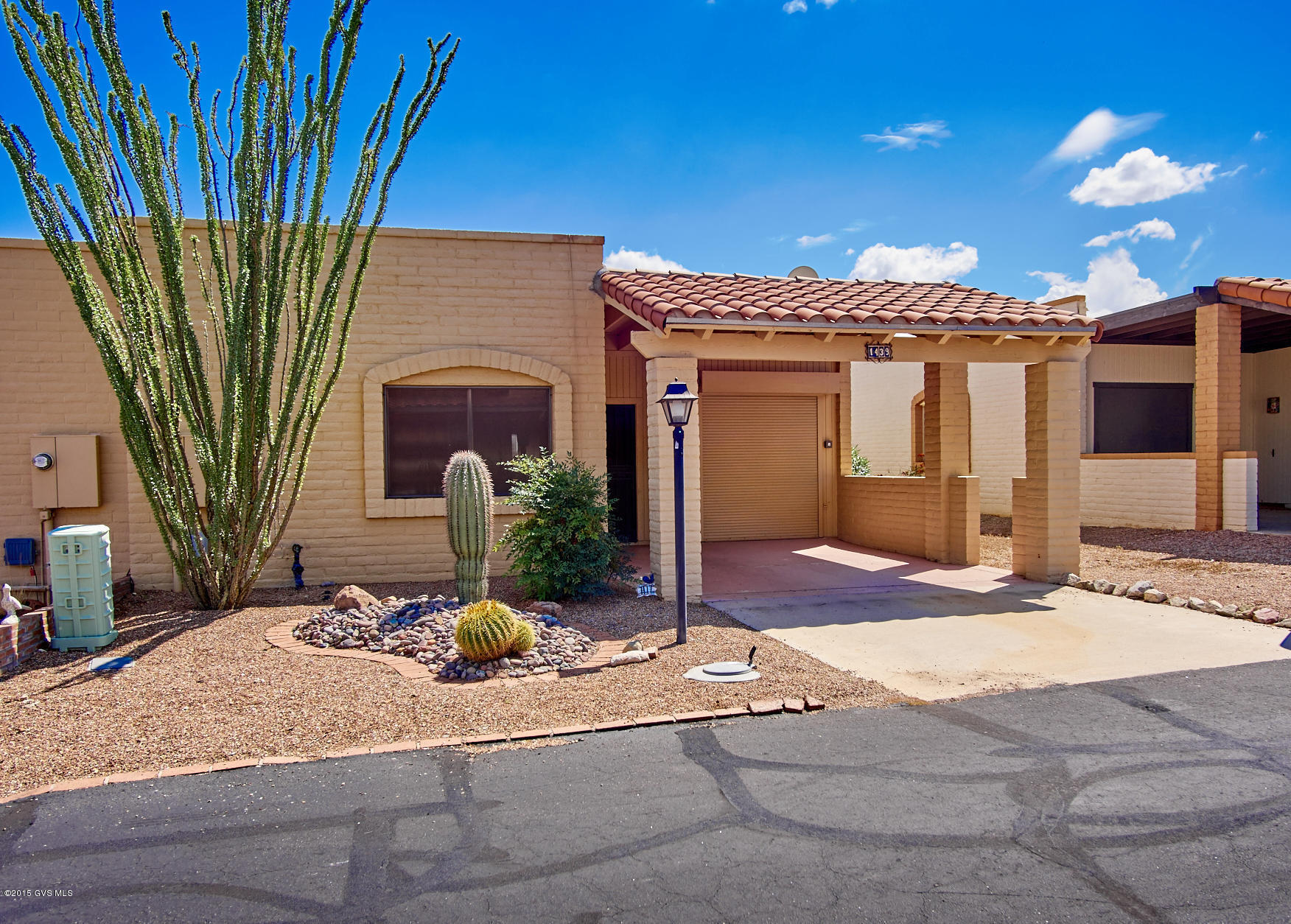 This adorable Townhome is fully furnished, great for seasonal visitors or full time owner. Views of the Santa Rita Mnts. Sunrise/Sunset from the cozy Arizona room. Lots of kitchen cabinets, wet bar and separate dining room. Skylights, ceiling fans all for your pleasure & comfort. UNIQUE GOLF CART GARAGE, w/ROLL DOWN DOOR.