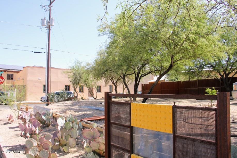 Gorgeous corner lot in the barrio! Two parcel codes, being sold together, this is the most sought-after location in Barrio Viejo! Take a stroll through the barrio and you'll realize the quiet perfection of S 9th Avenue, just a block west of Meyer.  Rare opportunity for the corner, nestled between the modern infill of Dos Pedros Lofts, and the Downtown Community School, a neighborhood preschool whose motto is ''teach through love.'' Life and location don't get any better than this! Developers: these lend themselves to two-story design, but as on large lot, it affords you the space to do a lovely one-story custom home. One water meter already installed.