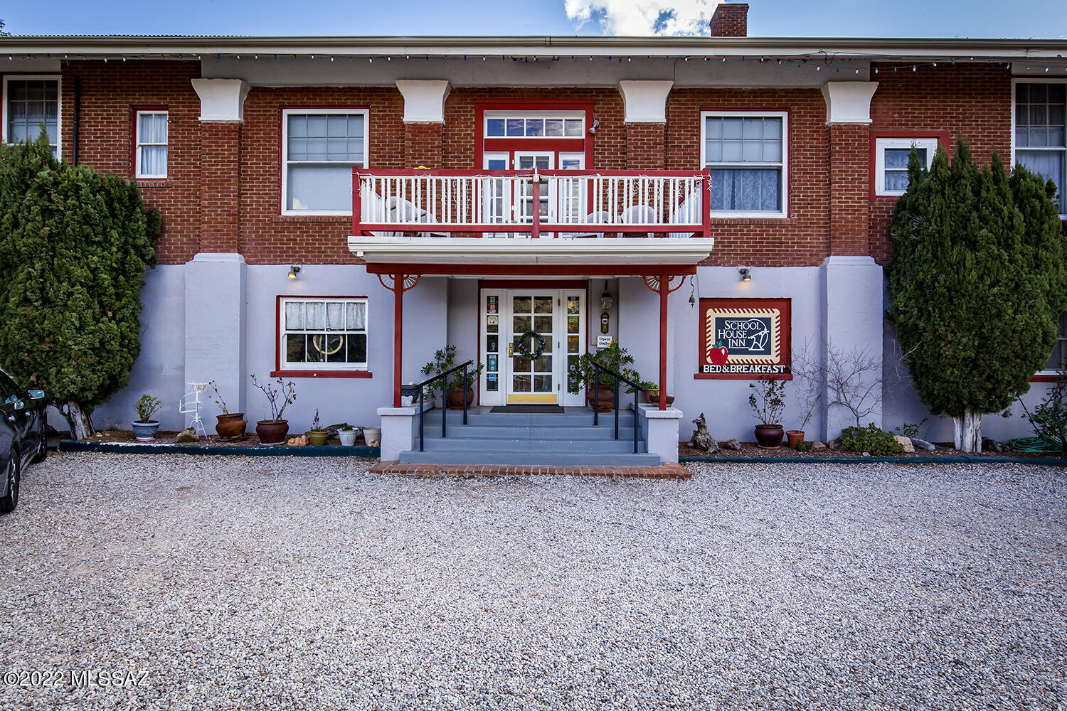 Buyer will accept backup offer! 
This sweet B&B in Old Bisbee, originally the Garfield School, is now The School House Inn. A historic building of solid brick construction & metal roof contains 10 bdrms/13 baths plus an Owner's Suite. All units have 12' ceilings & private baths. Building features original woodwork detailing; a large dining room opening onto a tranquil oak-shaded patio with and sitting areas to enjoy the views & breezes; kitchen; walk-in pantry; laundry; workshop; storage; central heat & plenty of deeded parking. There's a front balcony with panoramic views. R3 zoning allows multi-family units, or this could become your dream home!  New owner may change zoning to commercial with a special use permit from the City. All furnishings/décor/bedding stays. Buyer to verify all facts. Will consider Owner Carry