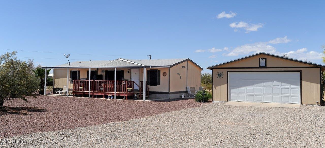 FANTASTIC home on an acre with a 2 car cooled garage, views. Recent 
owner-added improvements include: electronically controlled gate, awesome front deck with awning to enjoy those (still) cool nights, side deck, front landscaping & fire pit, new 2-tone exterior painting of home, garage & storage shed, sun screens on windows, rain gutter system. PRIDE OF OWNERSHIP! Includes ALL appliances inc. 2 refrigerators, washer/dryer. Owner offering 2-10 buyer warranty. Totally MOVE-IN ready. MUST see!