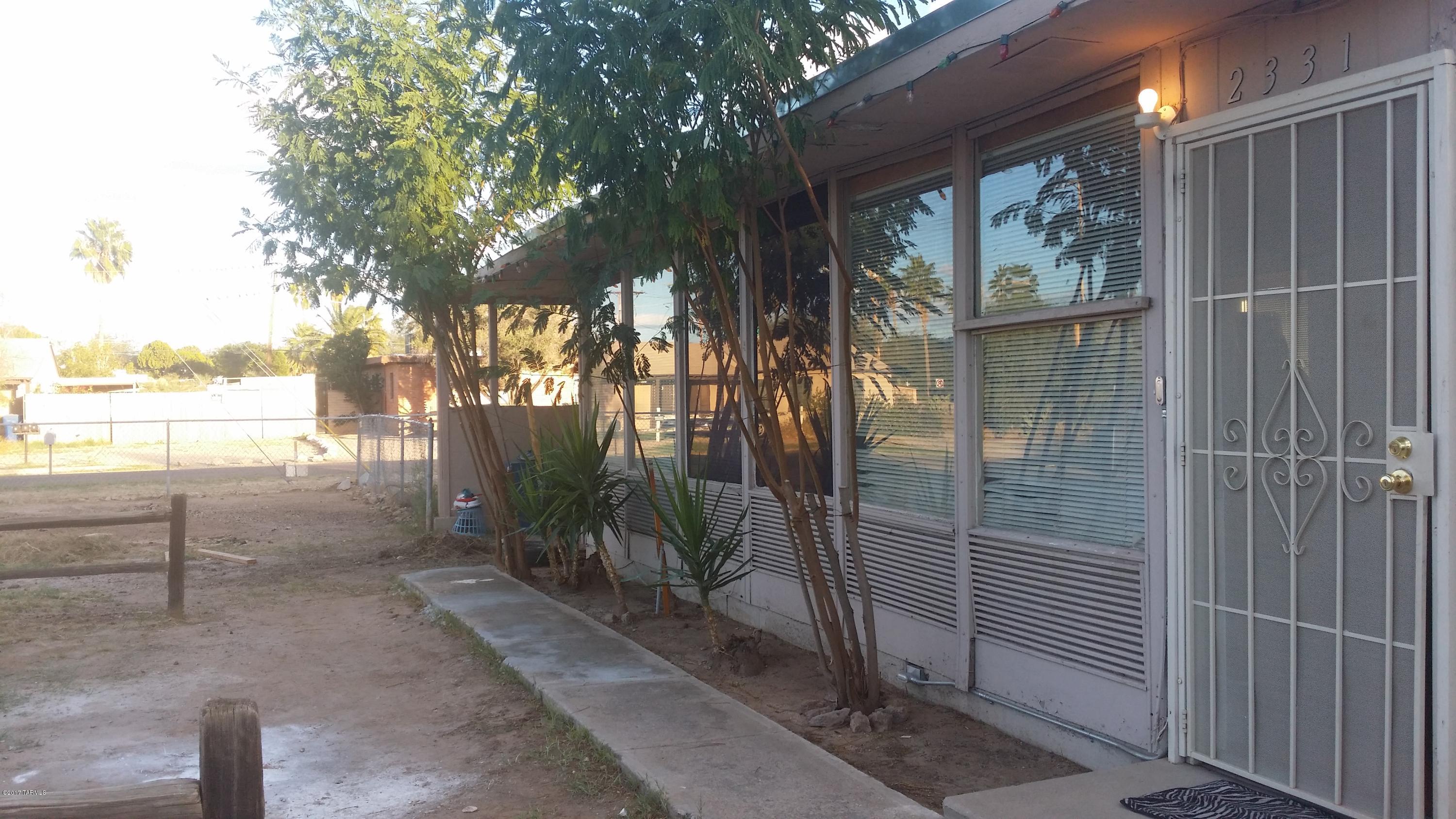 Two cute 2BD, 1BA single family homes on a .24 acre lot. Better than a duplex-both homes have large yards and one has a carport and the other a garage. Square footage includes both homes at 672 sf each. Many improvements have been made over the last 4 years. 1/2 block off Grant for ease of public transportation and convenient shopping. Approx. 2 1/2 mi. from the Univ. of AZ. Utilities metered separately for the units. Both homes are currently leased. Homes being offered As-Is.