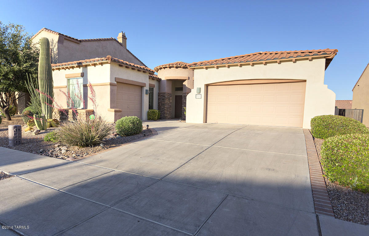 Beautiful one-story home in one of Rancho Sahuarita's most desirable neighborhoods. Situated on a nice premium lot, this tastefully decorated home feature a gorgeous kitchen w/rounded island/breakfast bar and neutral paint tones. Huge master suite w/garden tub & separate shower. Large, elevated landscaped backyard w/ covered patio, mature landscaping, raised flowerbeds, waterfall and views of the Santa Rita Mountains. Alarm system, ceiling fans, ALL APPLIANCES and window coverings are included! All that PLUS a 3 CAR GARAGE. Close to Sahuarita Lake, neighborhood park and the Wilderness Trail. Don't miss out on this clean, quality home!