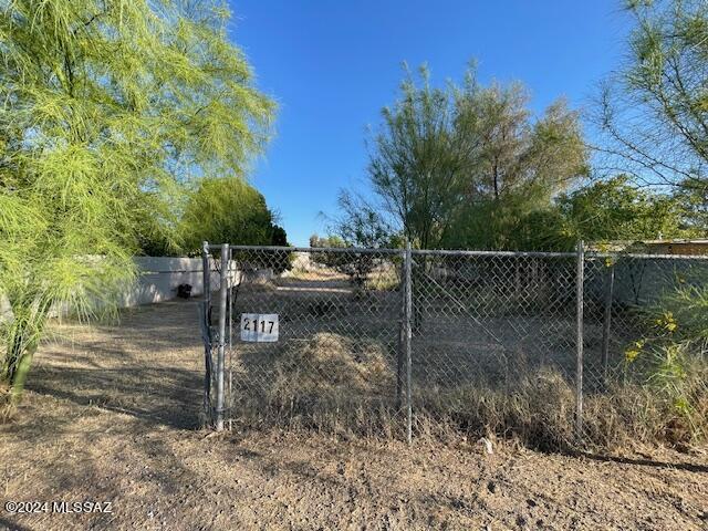 Vacant land available, zoned MU, spanning .25 acres. The property features two 6-foot block walls and alley access, with utilities readily accessible. Sewer or septic installation is needed. MU zoning allows for a variety of uses including duplexes, multiple dwellings, manufactured homes, trailer courts, community service agencies, clinics, and more. Please consult the Pima County website for detailed zoning information. Sold As-Is. Seller is open to financing with 30% down payment.
