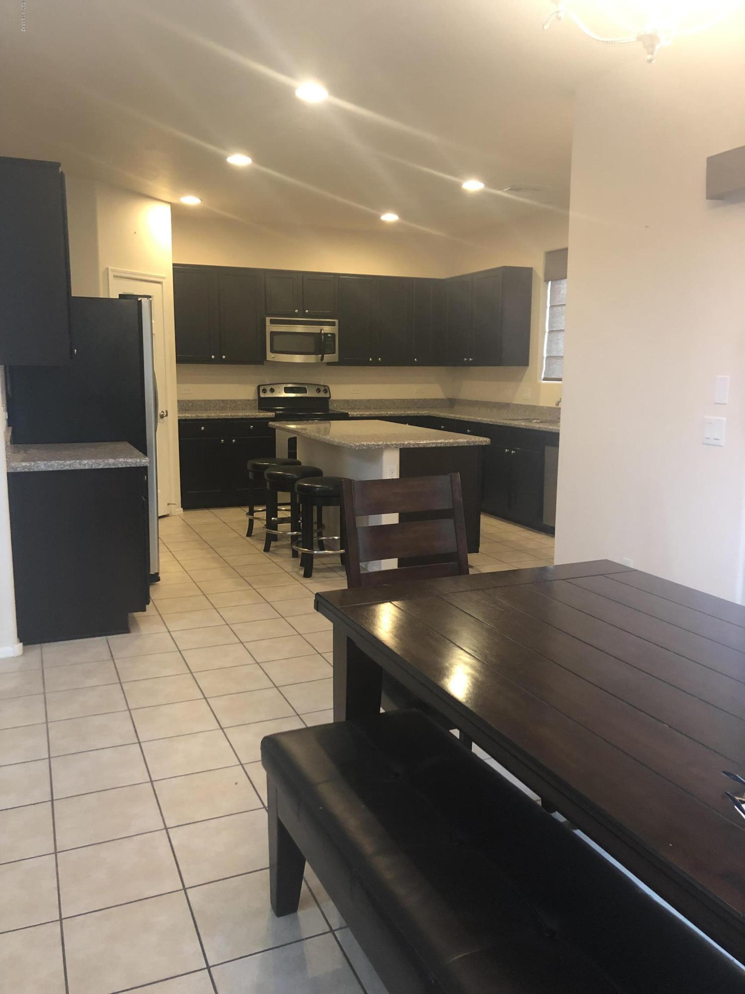 Beautiful 5 bedrooms in Rancho Sahuarita. Features tile floor, granite counters, large kitchen with island, stainless appliances, vaulted ceilings, luxurious master bedroom with huge walk in closet