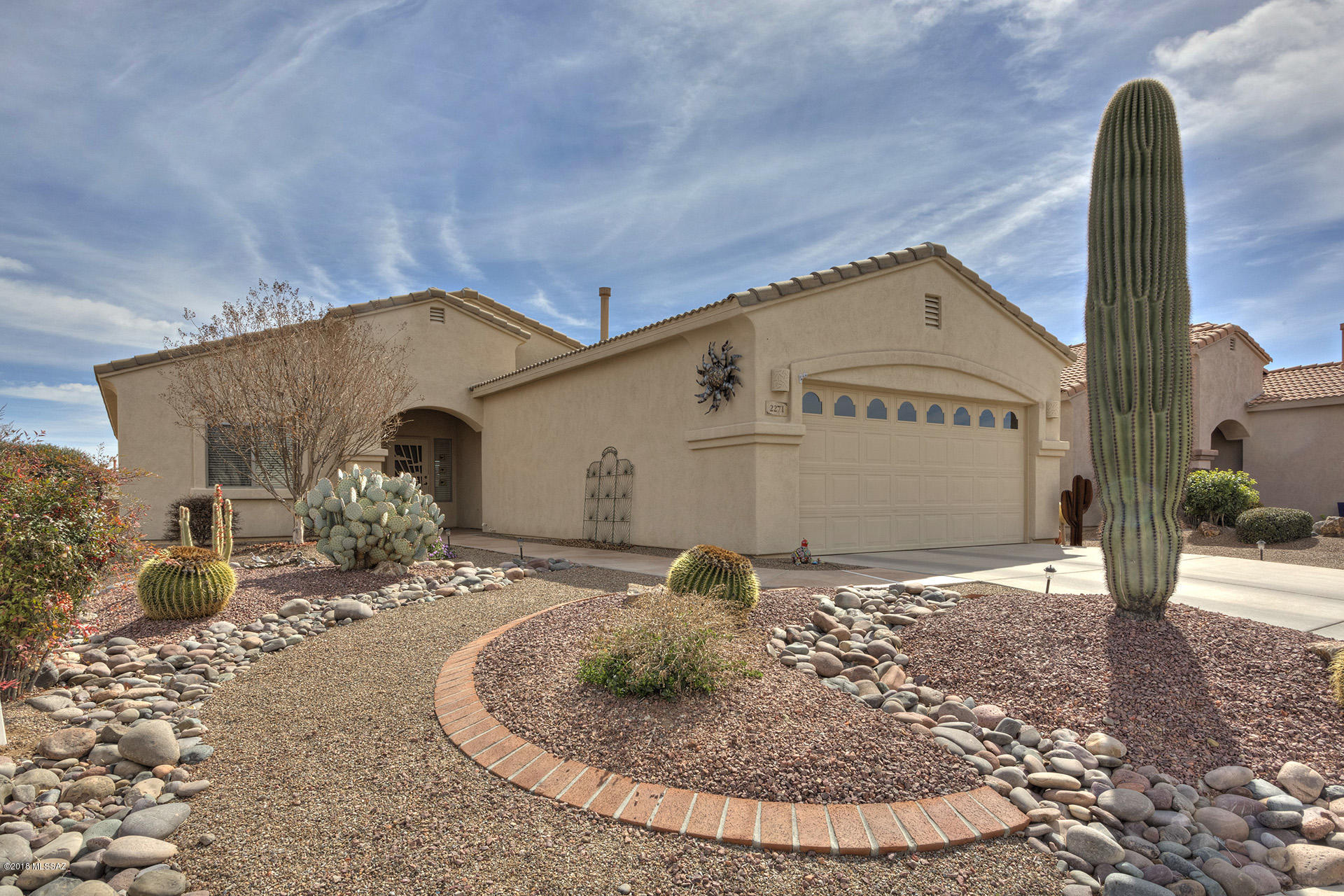 This highly upgraded and well maintained home in The Legends will impress you from room to room! Before you enter, you'll notice the professionally landscaped front yard. Inside, a kitchen remodel done in 2013 with top of line stainless steel appliances including a Bosch dishwasher. Granite counter tops and a tile backsplash were also added as well as a new sink and faucet and lighting. ''Off The Wall'' built a custom desk for the den with file drawers, bookcases and a double Murphy bed and table. The bedrooms have upgraded carpet. The Master Closet was custom designed  with an extensive organizer system. The bathrooms have new sinks, faucets and new high toilets. In the Master Bath, the shower was completely updated. Interior painted in 2013; exterior in 2012; travertine marble back patio Security screen front door. Epoxy garage floor and built-in cabinets. All house surge protector! Recirculating pump for instant hot water. French drain added in back patio area to prevent rain water retention. Two fruit trees in the backyard!