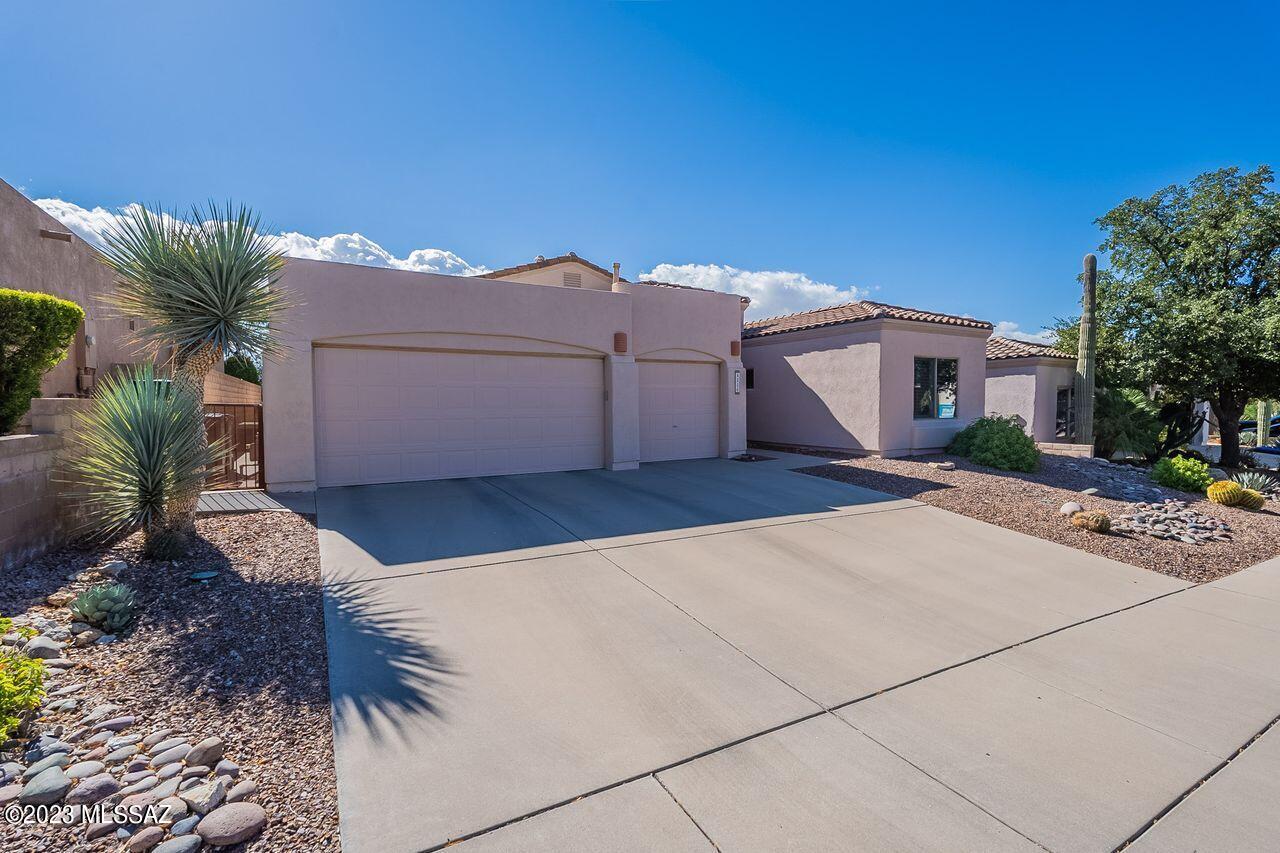 Located on the 18th Green of the Arizona National Golf Course in the gated community of Sabino Springs is the home you've been waiting for! Soaring ceilings, open floorplan, beautiful finishes, wonderful views & a spool with a relaxing waterfall for year-round enjoyment, are just a few of the special features of this property. The third bedroom is set up as an office and is next to the other guest bedroom & hall bath. The primary bedroom is located on the opposite side of the home & has a door to the beautiful backyard. The primary bath is a Zen retreat, complete with jetted soaking tub & spacious shower. The 3-car garage has built-in cabinets for storage. Conveniently located near neighborhood amenities: community pool/spa, fitness center, guest rental casitas & the golf course.
