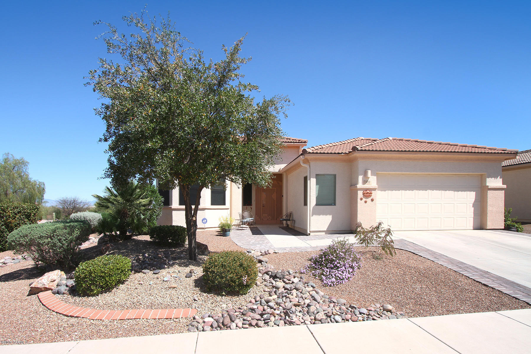 Yes! You can have it all! This Spectacular like-new 2 BR plus den/office home situated on a quiet corner lot & completely updated!Step intoa new tiled entry, decorator colors & great room offering wall of windows, spacious living area w/fireplace, inspiring kitchen w/corian & SS appliances. New dishwasher,range & microwave too! Remodeled Master suite w/tiled walk-in shower & executive height new vanities! 2 closets too! Entertain family & friends in prestigious AZ rm w/new 20x20 inch tile! New A/C & hot water heater plus new exterior paint-April 1. Irresistible guest rm w/ bay  window! Need storage or hobby space? Discover the 2.5 garage! Extraordinary home for your extraordinary lifestyle!