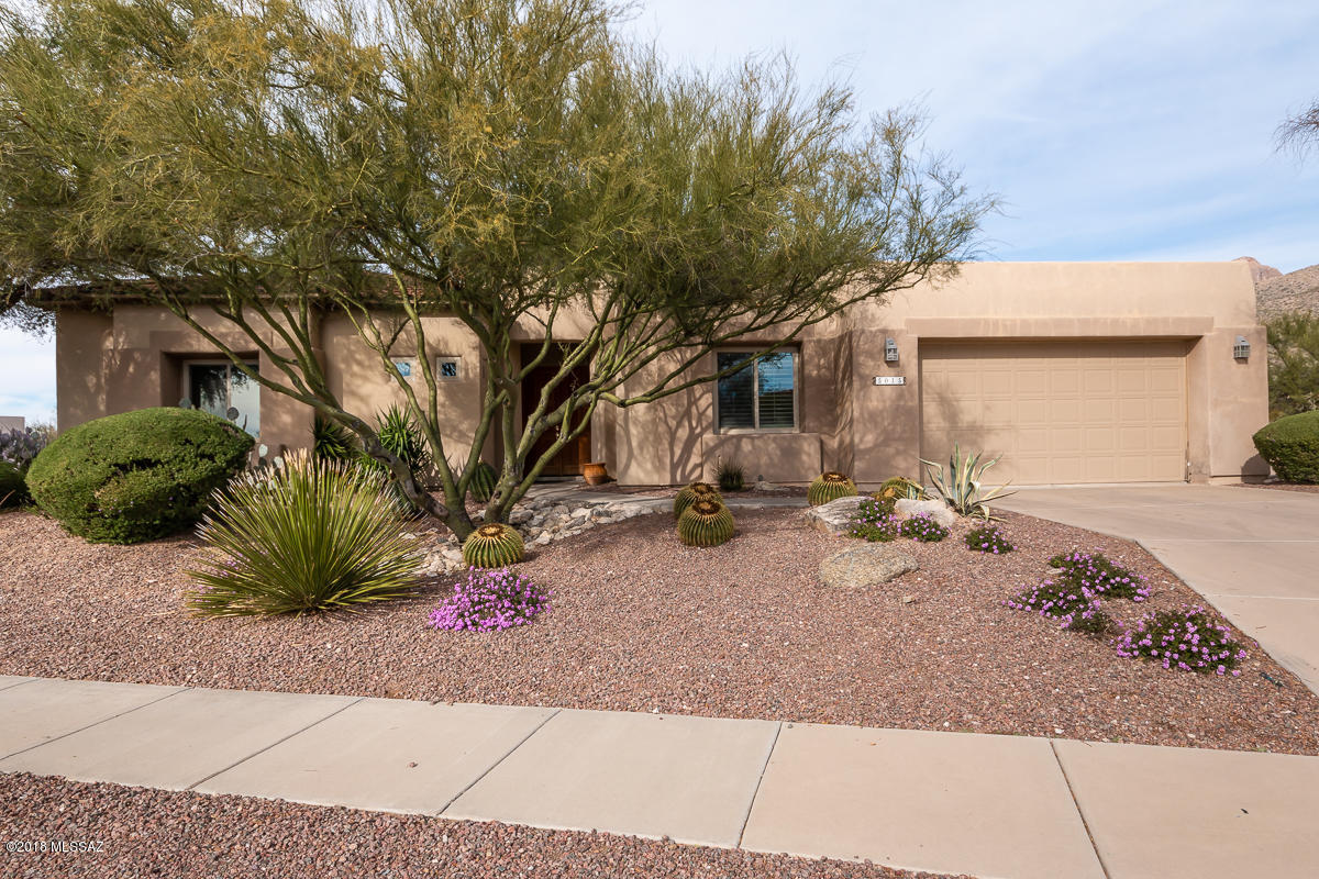HOME IS LOCATED OFF THE 13TH FAIRWAY. LOCATED AT THE END OF A CUL DE SAC ON A PREMIUM OVERSIZED 0.42 ACRE LOT. 3 BEDROOMS PLUS A DEN/OFFICE. THIS HOME HAS MOUNTAIN/SUNSET & GOLF COURSE VIEWS. LOCATED IN THE GATED SABINO SPRINGS COMMUNITY. FORMAL DINING ROOM, GOURMET KITCHEN,  5 BURNER GAS STOVE TOP, REFRIGERATOR, OPEN BREAKFAST AREA ADJACENT TO FAMILY ROOM W/FIREPLACE, HIGH CEILINGS, WOOD SHUTTERS & BLINDS,, TILE FLOORS IN LIVING AREAS AND CARPET IN ALL BEDROOMS. MASTER SUITE OPENS TO THE COVERED REAR PATIO THAT IS METICULOUSLY LANDSCAPED WITH A WATER FEATURE.