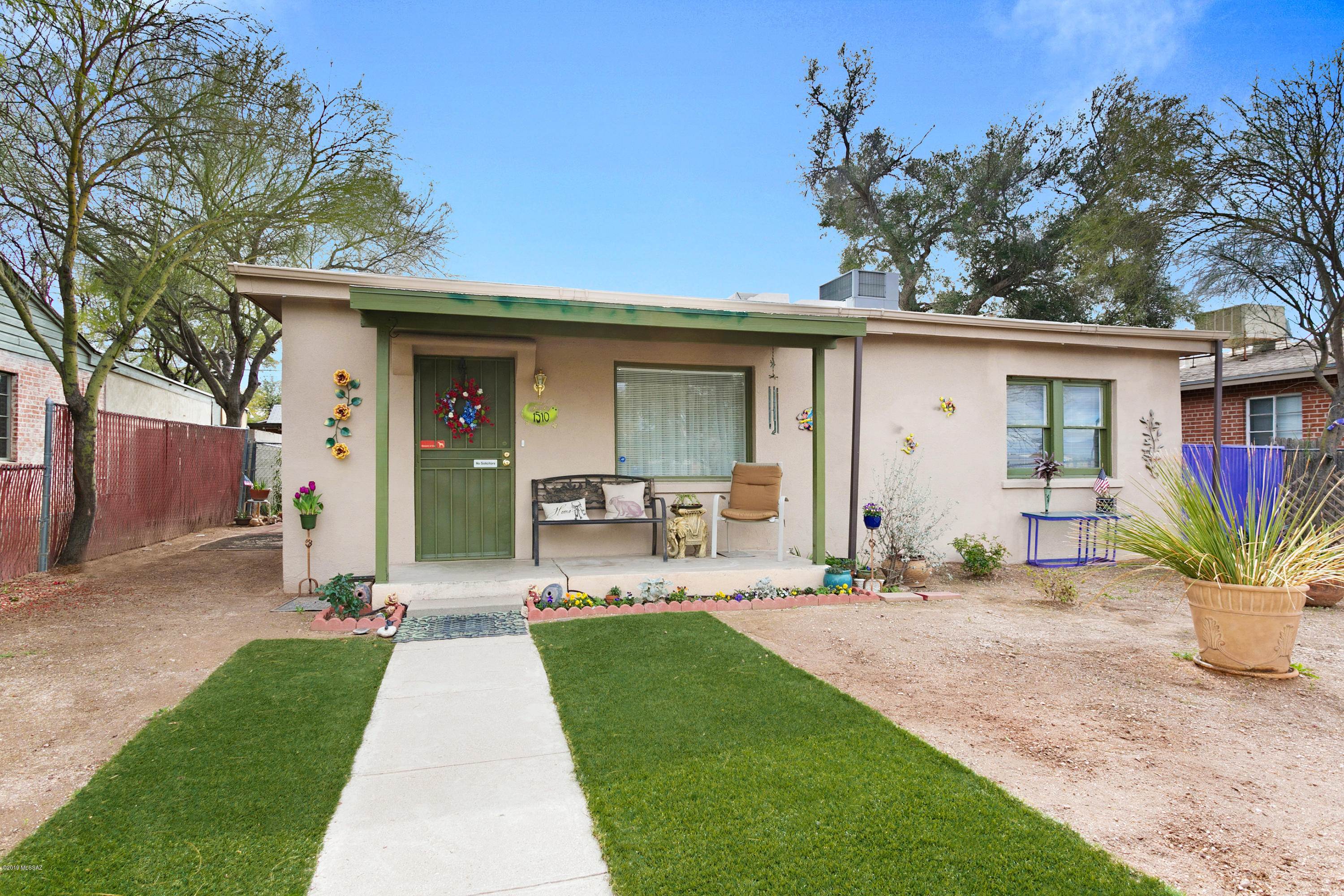 This little gem of a home is on a quiet street just a mile from the University of AZ.  All ready for a new loving owner and you won't have to do a thing! The spacious  eat-in kitchen has been completely renovated  with granite counter tops, gorgeous new  cabinets and 18'' tile.  All the appliances are only two years old and all are included.  The main house has lovely wood laminate flooring and has 2 bedrooms and one bath which is nicely upgraded. Main house has dual cooling (evap new in 2015) and AC and water heater are only 2 years old.  1BR/1bath Guest house with wood laminate flooring has large living area and  is ready for guests, cash flow tenants or would make an awesome studio. Large low care back yard and plenty of parking for at least 2 cars.  Close to downtown and  Reid Park Zoo