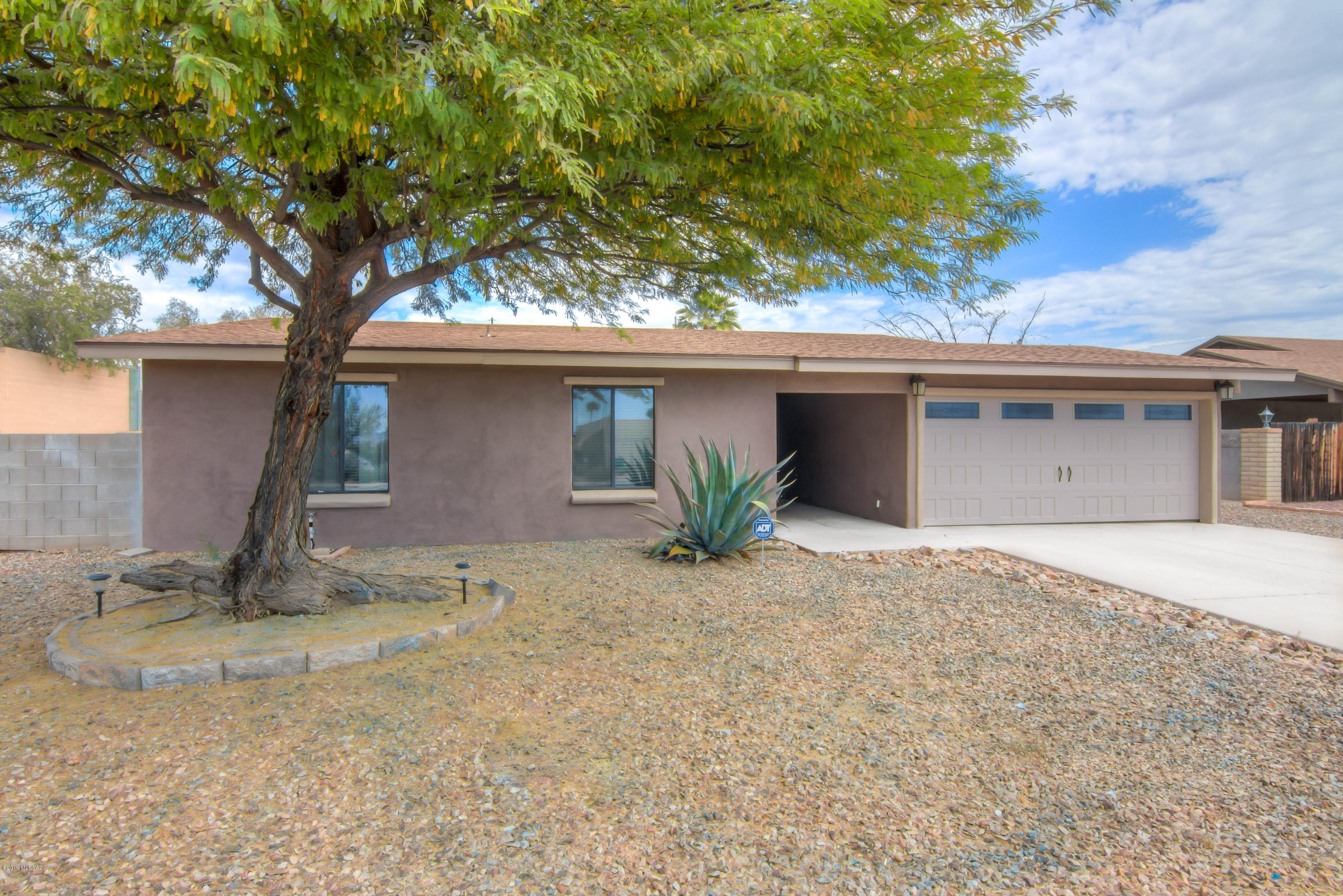 This property features finished concrete counter tops, stainless steel appliances including a vent less hood, upgraded cabinetry, tile flooring in living areas, upgraded bathrooms, fresh interior paint and a large lot on nearly a quarter of an acre. Two car garage plus gates leading to backyard with a large covered patio and plenty of room to park your toys. New roof installed in 2016 with 10'' insulation upgraded in attic. Call today for your private showing. Sellers will entertain offers from $200,000 to $210,000.