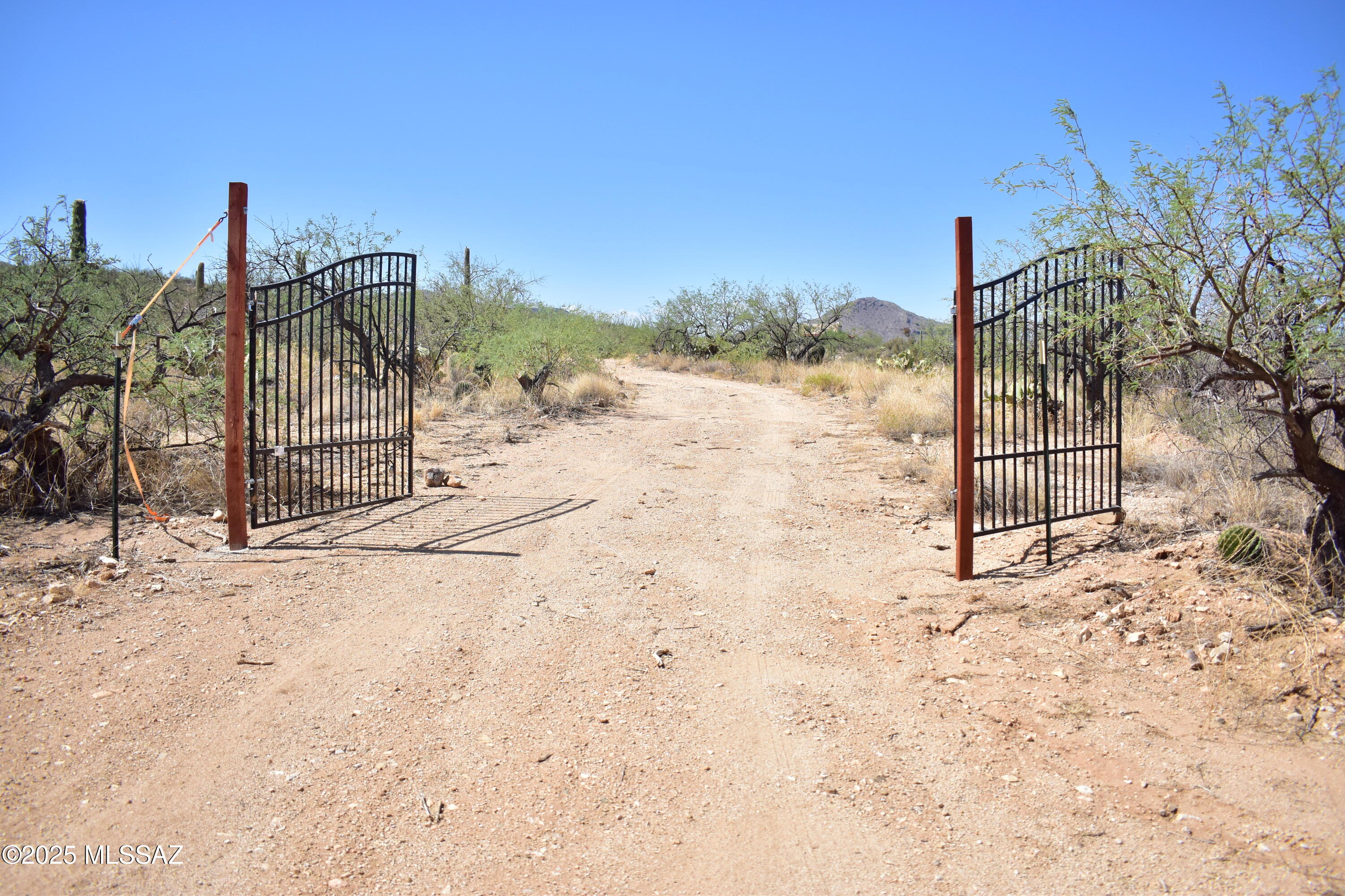 OWNER FINANCING AVAILABLE - Easy access, endless potential. This rare RH-zoned 10-acre parcel offers easy, direct entry via maintained dirt road & is primed for immediate construction. The building site is already cleared, w/  permits & plans for a 50' x 50' barndominium. Materials for the shell & a water storage tank are included.

The lot can be split into two 5-acre parcels, creating a unique investment opportunity: build 2 homes, live in one & sell the other, or retain the full acreage as your own private desert retreat. The southern boundary borders state land, ensuring lasting privacy & unobstructed views.

With breathtaking rolling topography and majestic saguaros dotting the landscape, this property delivers panoramic vistas and unforgettable sunsets that truly set it apar