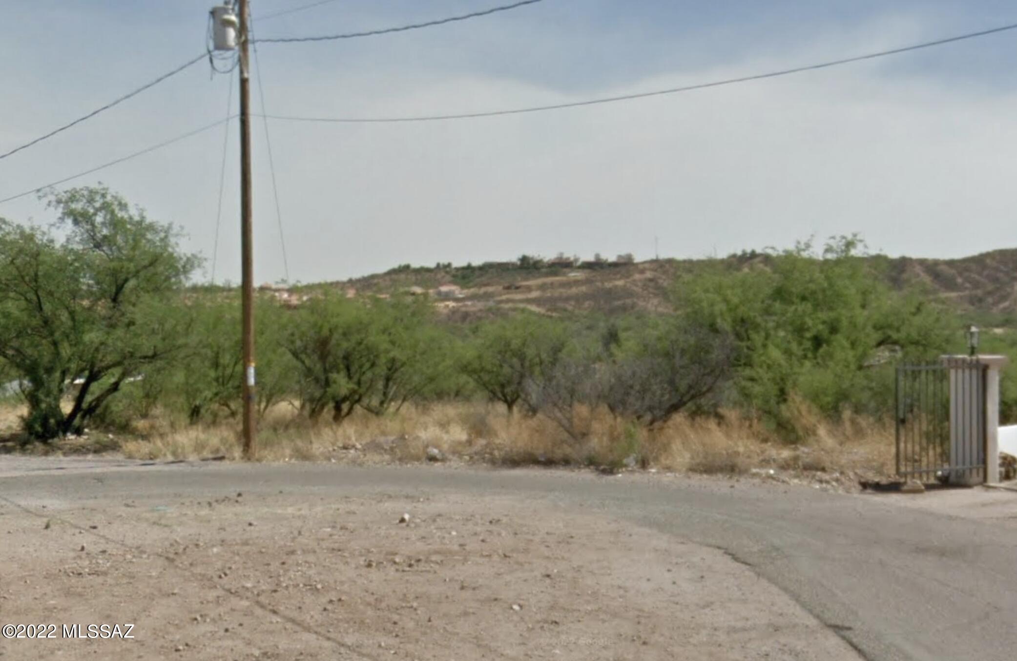 End of Cul-De-Sac property with views! Enough space for a single family residence or multi-family units. Water, sewer, and electric at property line.
